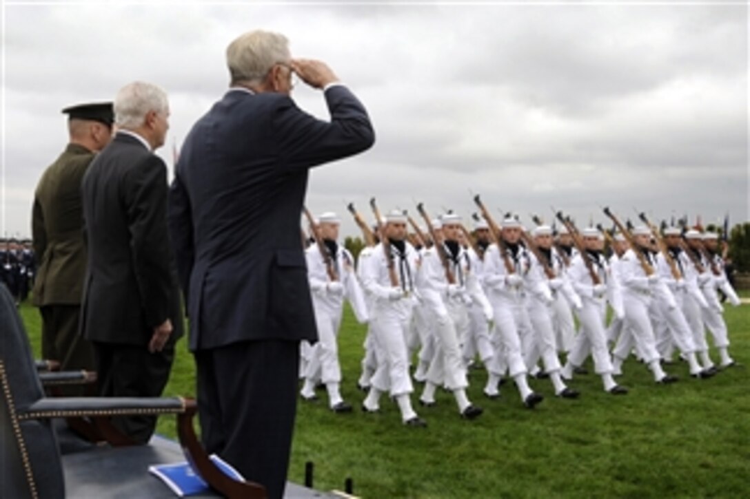 Vice Chairman of the Joint Chiefs of Staff Gen. James E. Cartwright (left), Secretary of Defense Robert M. Gates and retired rear admiral Jeremiah A. Denton Jr. (right) render honors during troop march-in-review as part of the National POW/MIA Recognition Day Ceremony at the Pentagon on Sept. 18, 2009.  