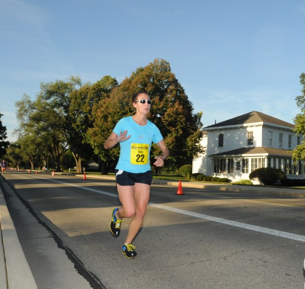 Kate Papenberg, the female winner of the full marathon, passes the Arnold House at approximately the 8.5 mile mark. The oldest building on Wright-Patterson, the house is named for Gen. Henry ‘Hap’ Arnold who lived there while he was base commander. (Air Force photo by Al Bright) 