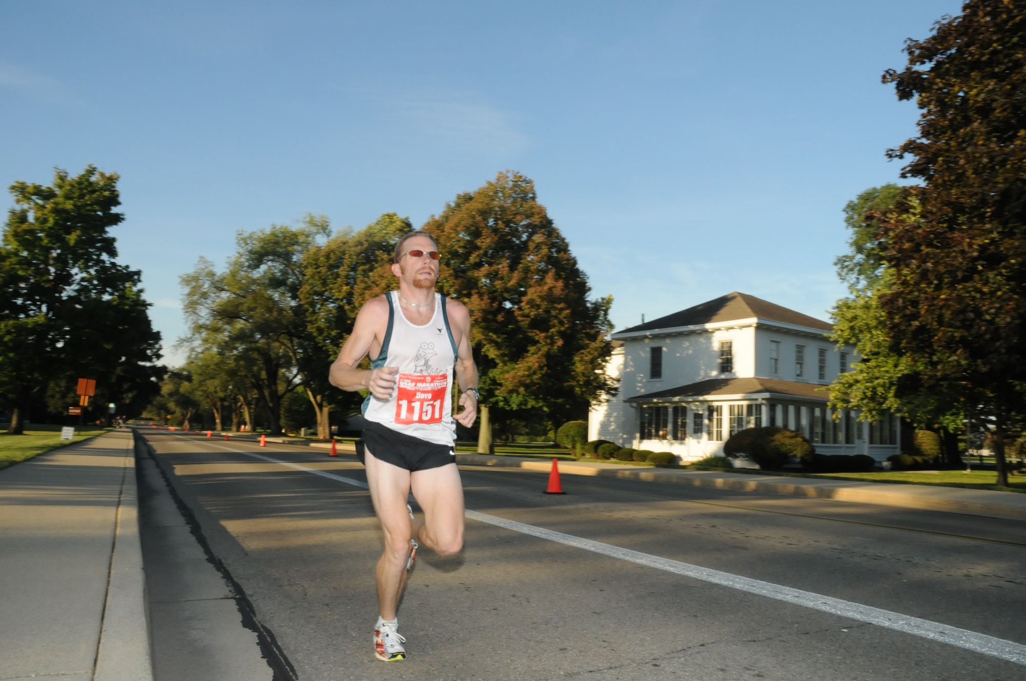Dave Johnston, the male winner of the full marathon, passes the Arnold House at approximately the 8.5 mile mark.  The oldest building on Wright-Patterson, the house is named for Gen. Henry ‘Hap’ Arnold who lived there while he was base commander.  (US Air Force photo by Al Bright)