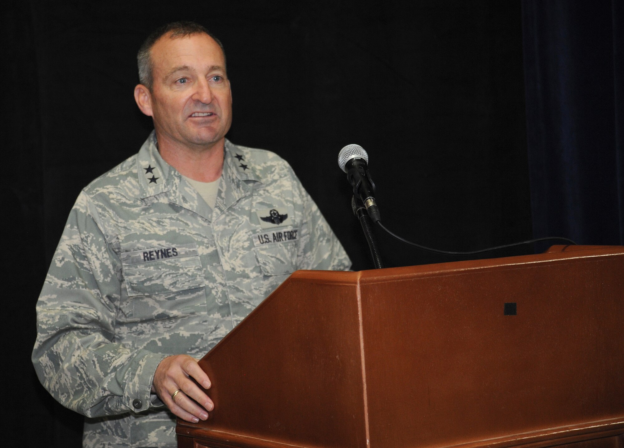 CAMP VICTORY, Iraq -- Air Force Maj. Gen. Joseph Reynes Jr., Air Component Coordination Element director, speaks to more than 200 servicemembers during a ceremony celebrating the Air Force's 62nd birthday at Al Faw palace here Sept. 18, 2009. Although the atmosphere was light, General Reynes pointed out the seriousness of the event and said celebrating the United States Air Force's birthday provides Airmen an opportunity to reflect on the exceptional men and women who have built our heritage, and to look forward to the challenges that lie ahead. General Reynes feels that all Airmen should remember and honor the Air Force's history and those who answered our nation's call. (U.S. Air Force photo/Tech. Sgt. Johnny L. Saldivar) 
