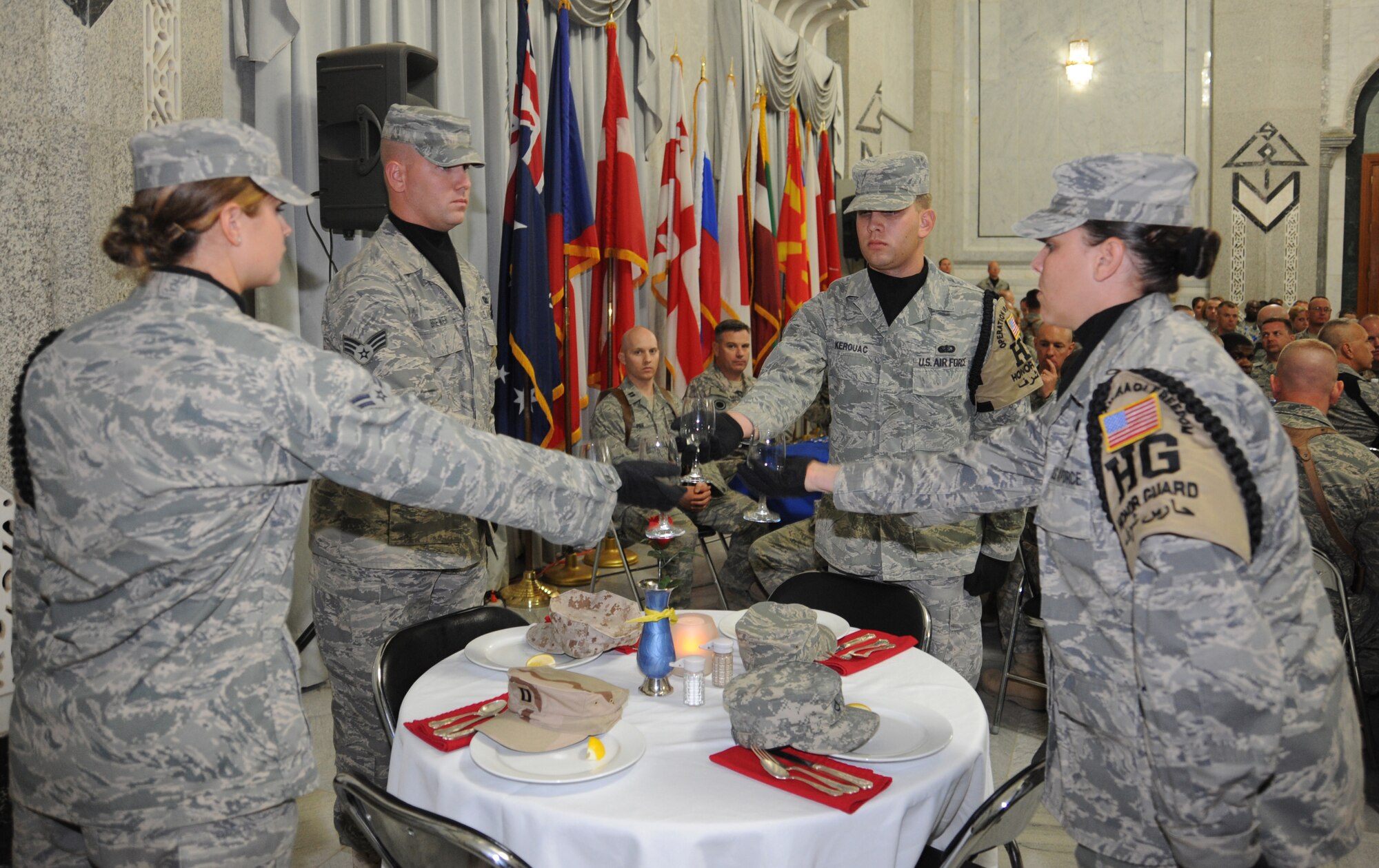 CAMP VICTORY, Iraq -- Members of the Sather Air Base honor guard perform a Prisoner of War and Missing in Action remembrance ceremony here during the Air Force?s 62nd birthday celebration at Al Faw palace Sept. 18, 2009. More than 200 servicemembers were in attendance, including Lt. Gen. Mike Hostage, Air Force Central Command commander, and Maj. Gen. Joseph Reynes Jr., Air Component Coordination Element director, who served as the keynote speaker for the evening.  (U.S. Air Force photo/Tech. Sgt. Johnny L. Saldivar)