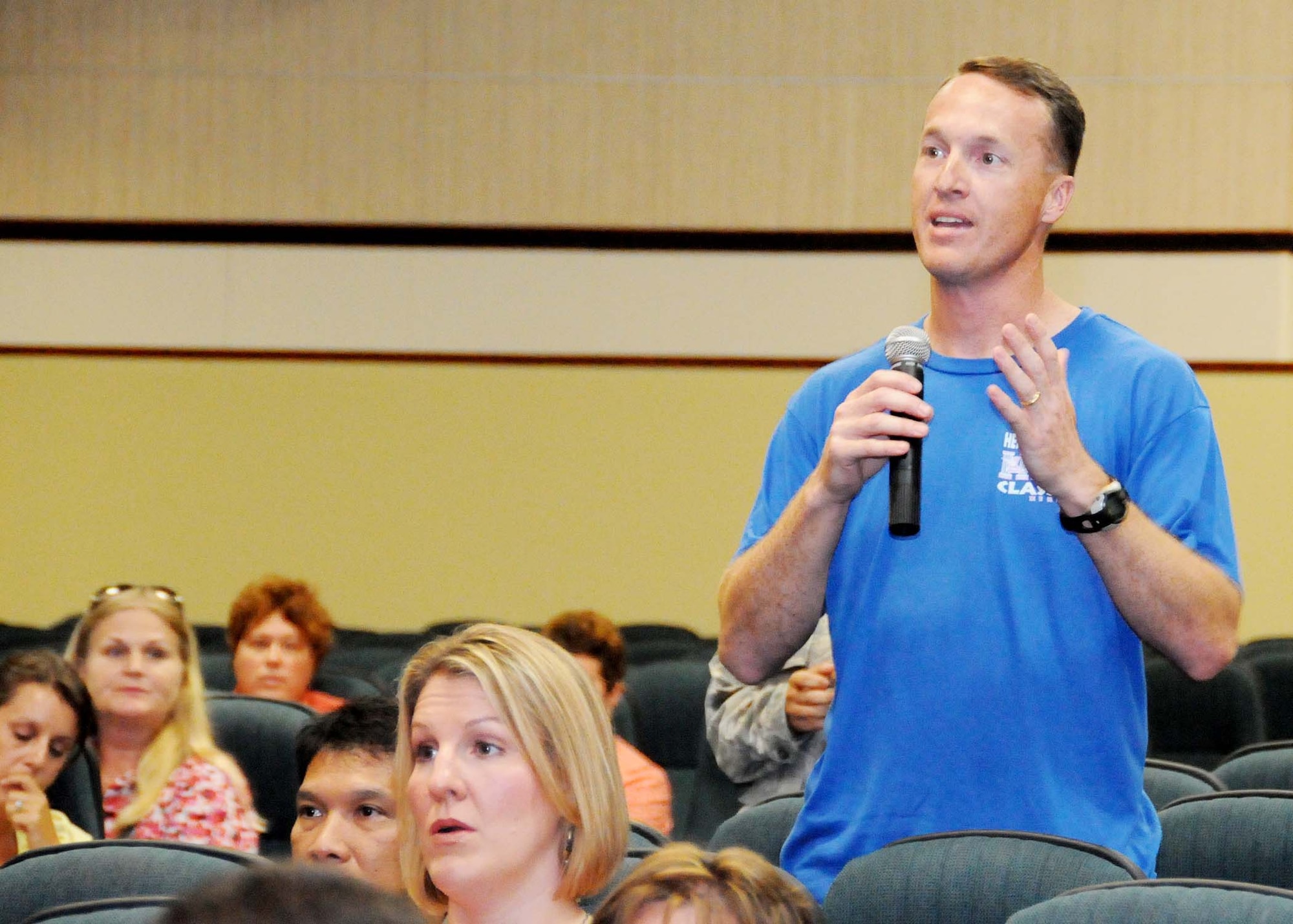 ANDERSEN AIR FORCE BASE, Guam - Master Sgt. Tracy Johnston, 36th Mobility Response Squadron, requests support for an issue regarding one of his dependent's health care at a town hall meeting held at the base theater Sept. 17. Col. Peter Brewer, 36th Medical Group commander, met with Sergeant Johnston following the meeting. (U.S. Air Force photo by Senior Airman Nichelle Anderson) 