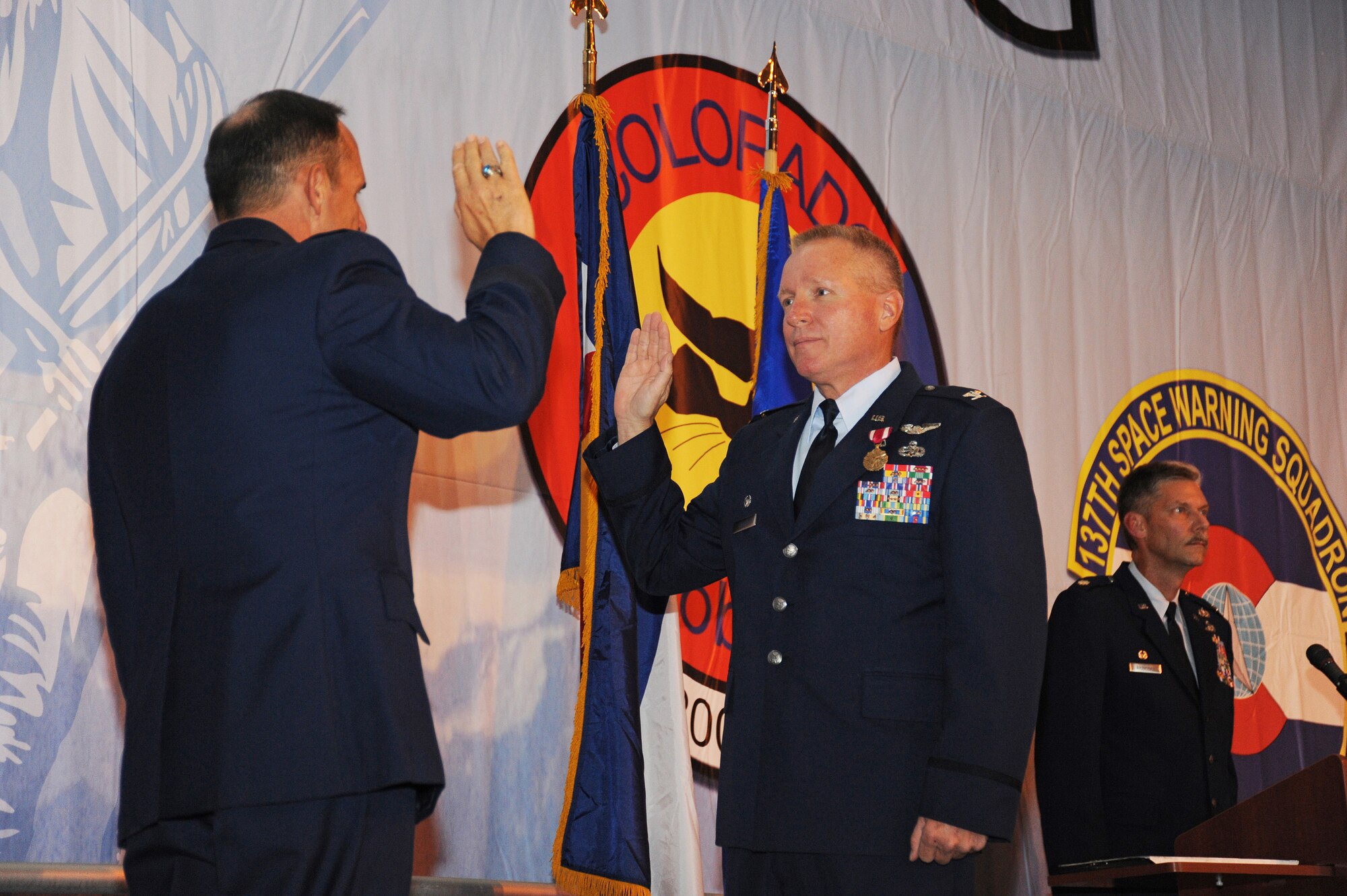 Brig. Gen. Trulan Eyre, Commander of the 140th Wing, administers the oath to  Colonel Thomas Shetter, Commander of the 140th Maintenance Group, September 19, 2009 Buckley Air Force Base, CO.  Shetter is being promoted to the rank of Colonel after 24 years of dedicated leadership. (U.S. Air Force photo by Tech Sgt. Wolfram M. Stumpf, Colorado Air National Guard/Released)
