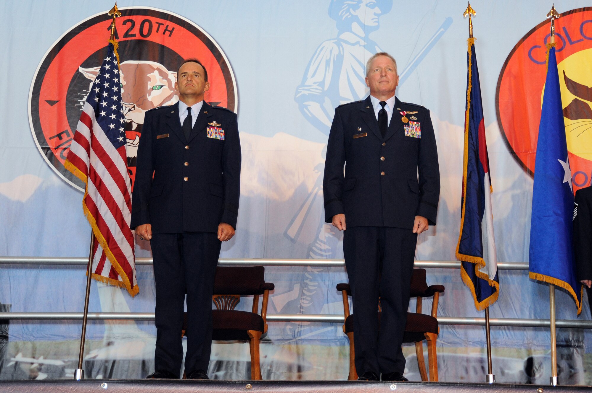 Brig. Gen. Trulan Eyre, Commander of the 140th Wing, along with Lt. Col. Thomas Shetter, Commander of the 140th Maintenance Group, stand at attention as the orders for promotion are read September 19, 2009 Buckley Air Force Base, CO.  Shetter was promoted to the rank of Colonel after 24 years of dedicated leadership. (U.S. Air Force photo by Tech Sgt. Wolfram M. Stumpf, Colorado Air National Guard/Released)