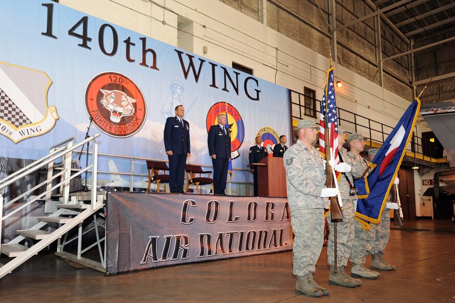 Brig. Gen.l Trulan Eyre, Commander of the 140th Wing, along with Lt. Col. Thomas Shetter, Commander of the 140th Maintenance Group, stand at attention during the National Anthem September 19, 2009 Buckley Air Force Base, CO.  Shetter was promoted to the rank of Colonel after 24 years of dedicated leadership. (U.S. Air Force photo by Tech Sgt. Wolfram M. Stumpf, Colorado Air National Guard/Released)