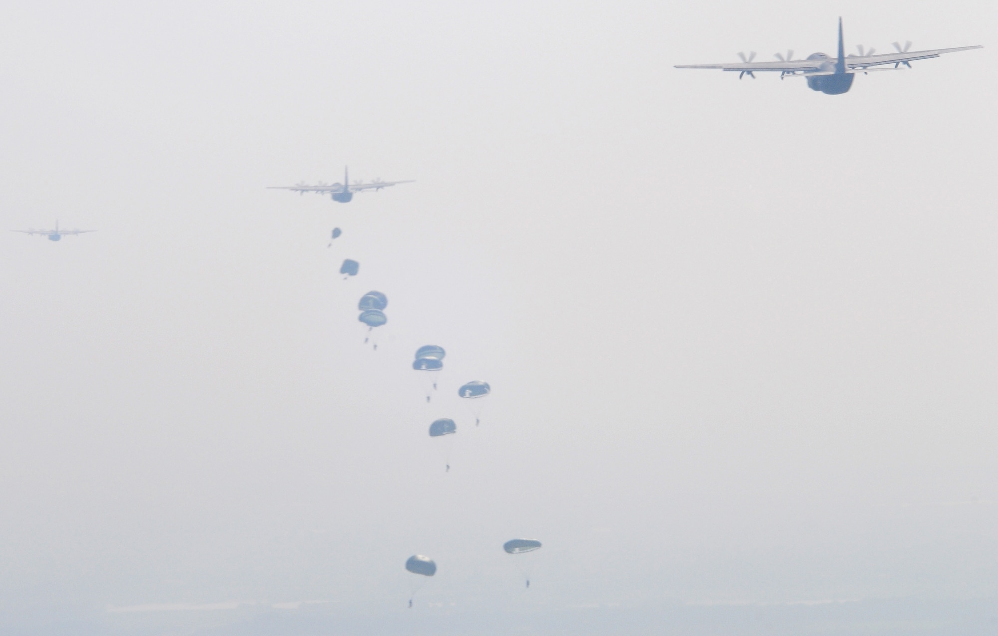 Military members from six countries participated in the over 1,000-person jump over Arnhem, Holland, Sept. 19, 2009.  The event commemorated the 65th anniversary of Operation Market Garden. United States, United Kingdom, Holland, Polish, and German paratroopers jumped from C-130Js from Ramstein Air Base, Germany.  (U.S. Air Force Photo by Staff Sgt. Jocelyn Rich)