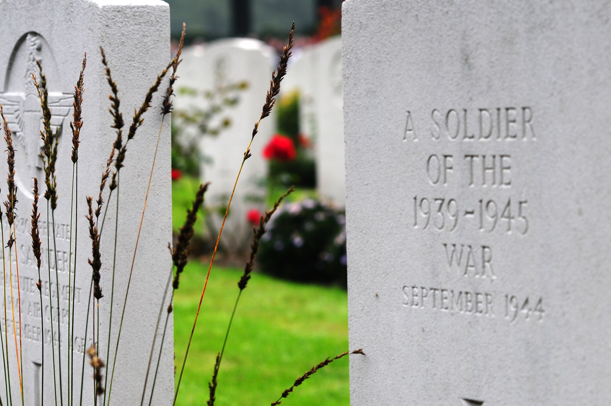 An unknown grave amidst the others at the Oosterbeek War Cemetery in Oosterbeek, Holland was remembered today during the 65th anniversary of Operation Market Garden.  Local Dutch children laid flowers on every grave as veterans and dignitaies looked on, Sept. 20, 2009. (U.S. Air Force photo by Staff Sgt. Jocelyn Rich)