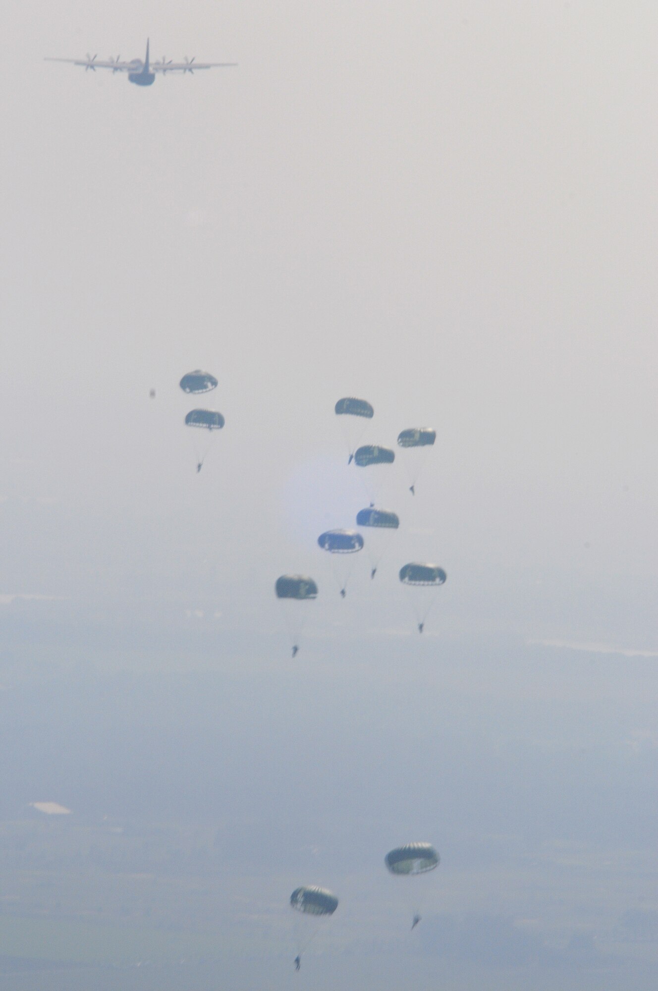 Military members from six countries participated in the over 1,000-person jump over Arhem, Holland, Sept. 19, 2009.  The event commemorated the 65th anniversary of Operation Market Garden. United States, United Kingdom, Holland, Polish, and German paratroopers jumped from C-130Js from Ramstein Air Base, Germany.  (U.S. Air Force Photo by Staff Sgt. Jocelyn Rich)