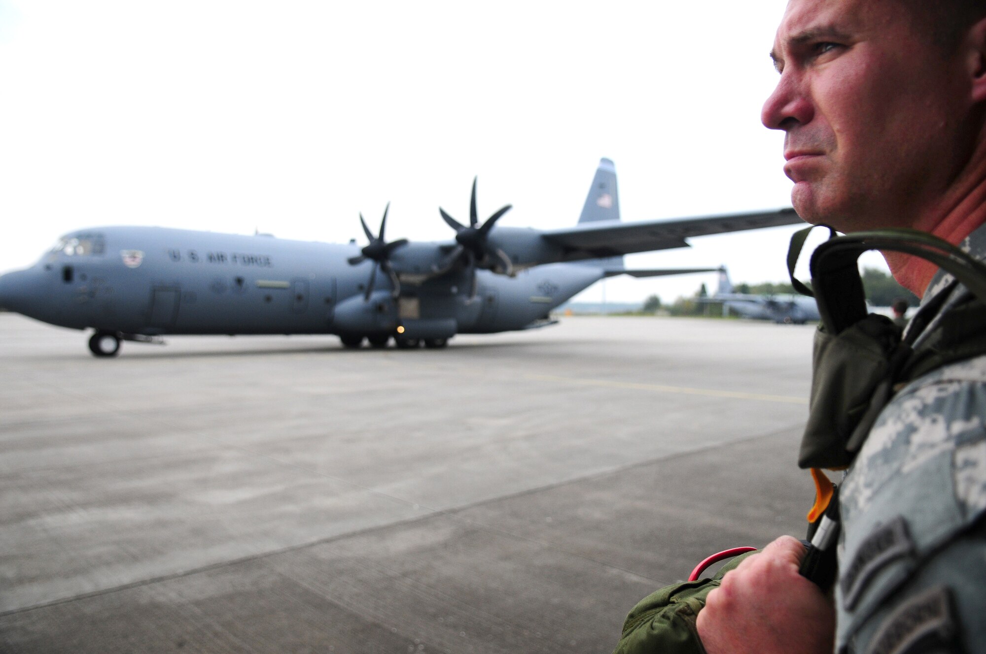 A U.S. Soldier from the 101st Airborne Division waits for a U.S. Air Force C-130J from Ramstein Air Base, Germany, to get into position to board for a jump to commemorate the 65th anniversary of Operation Market Garden, Holland.  Military members from the United States, United Kingdom, Holland, Germany and Poland all participated in the jump on Sept. 19, 2009. (U.S. Air Force Photo by Staff Sgt. Jocelyn Rich)
