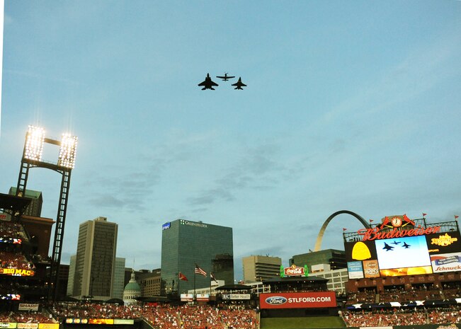SCOTT AIR FORCE BASE, Ill. -- Air Force airplanes, F-15, P-51 and F-16 performed a flyover over Busch Stadium after the national anthem for the Cardinals vs. Cubs game. The Army Golden Knights were present and parachuted into the stadium to hand the first pitch baseball to Brig. Gen. A.J. Stewart, commander of Air Force Recruiting. (U.S. Air Force photo/Tech. Sgt. Michelle R. Larche)