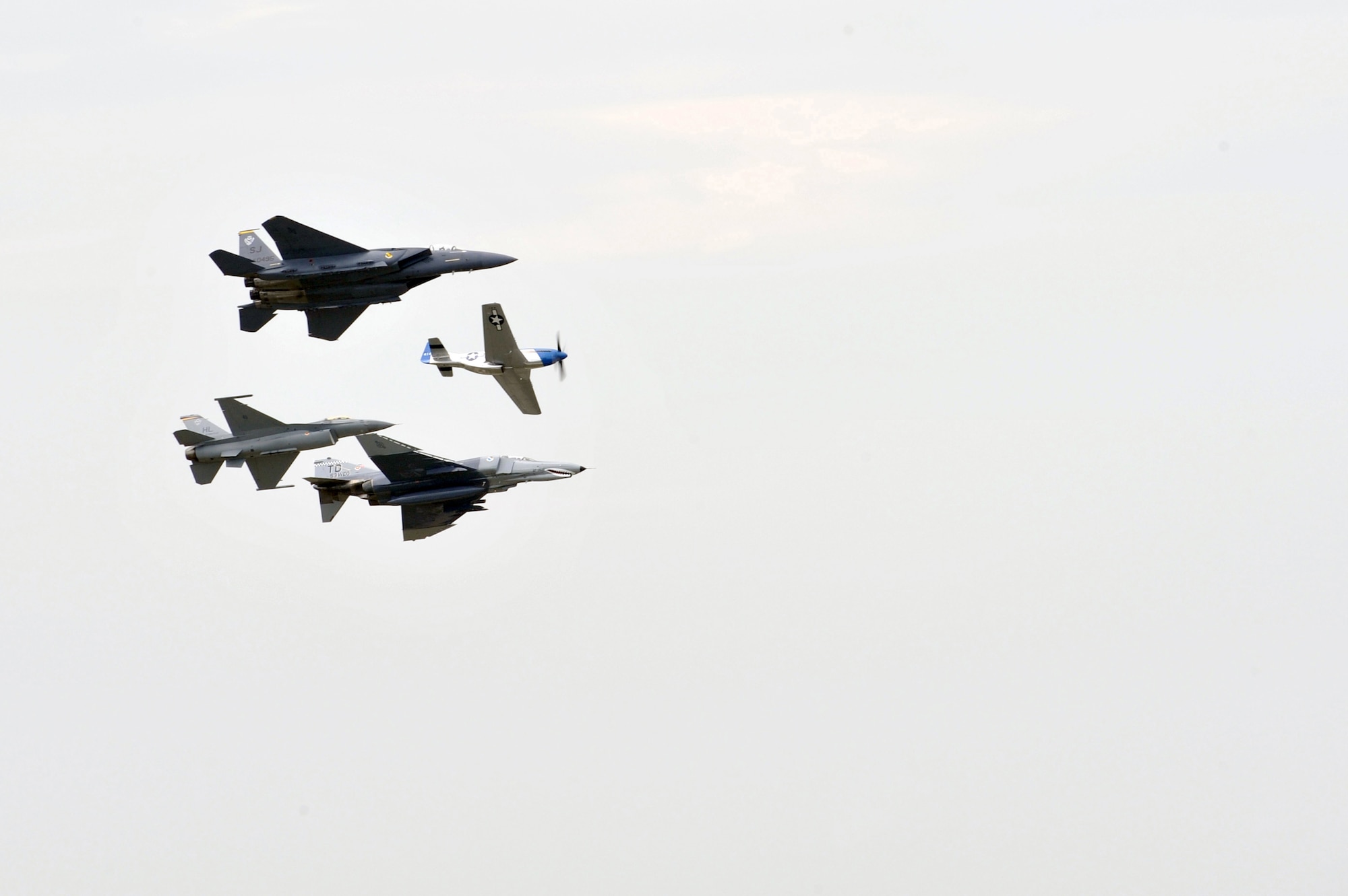 SCOTT AFB, Ill. -- A P-51 Mustang partakes in a Heritage Flight during the Airpower Over the Midwest Airshow Saturday. The heritage flight consisted of the P-51 Mustang leading the formation flight, the F-15E Strike Eagle, the F-16 Fighting Falcon and the F-4.(U.S. Air Force photo by Senior Airman Teresa M. Hawkins)
