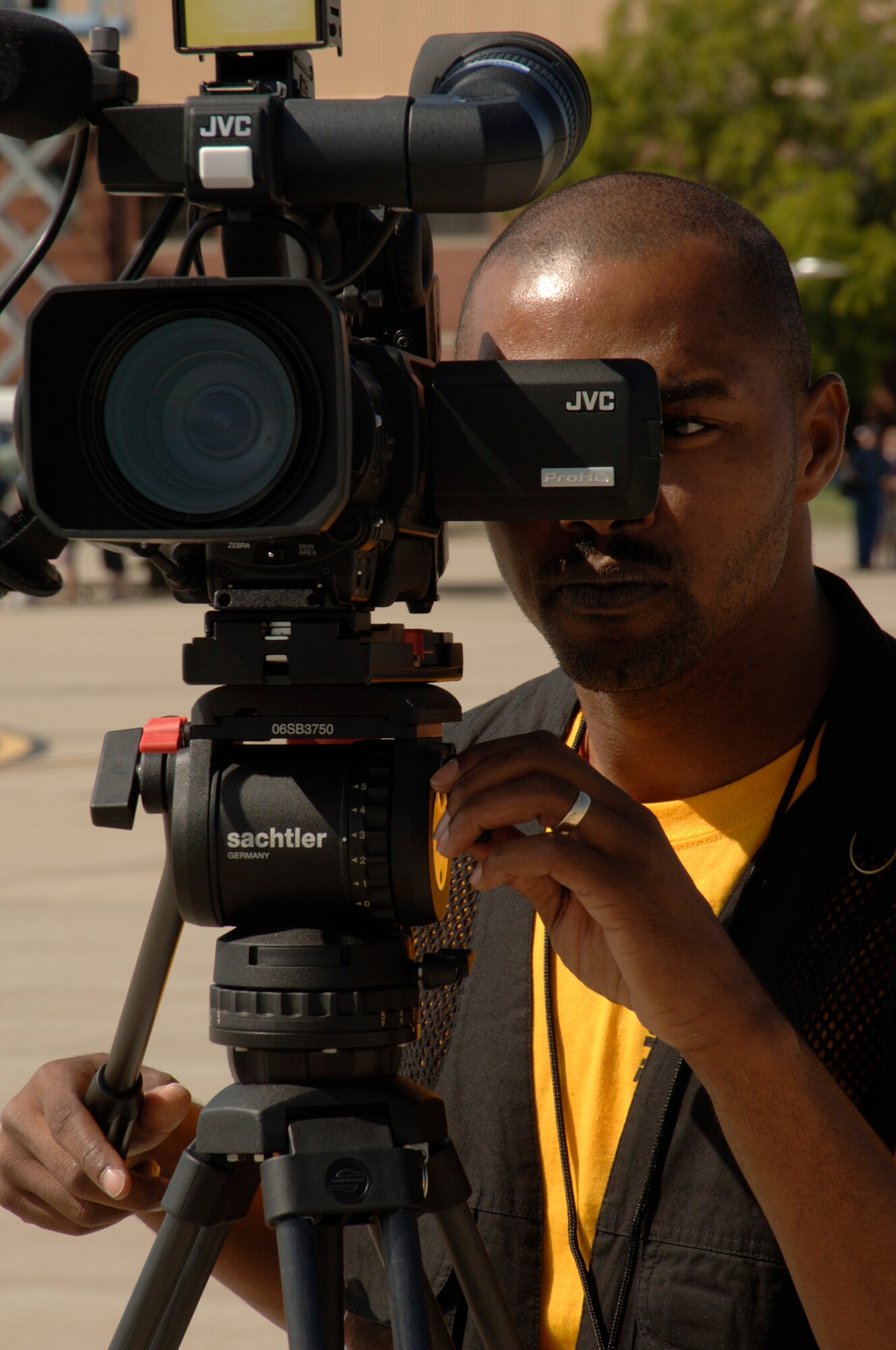 SCOTT AIR FORCE BASE, Ill. -- Staff Sgt. Bryan Magee captures video during the 2009 Airpower over the Midwest Airshow being held at Scott Air Force Base from Sept. 18-20.  Sergeant Magee was documenting the event as a videographer for the 375th Airlift Wing Public Affairs office. (U.S. Air Force photo/Master Sgt. Dave DeRemer)