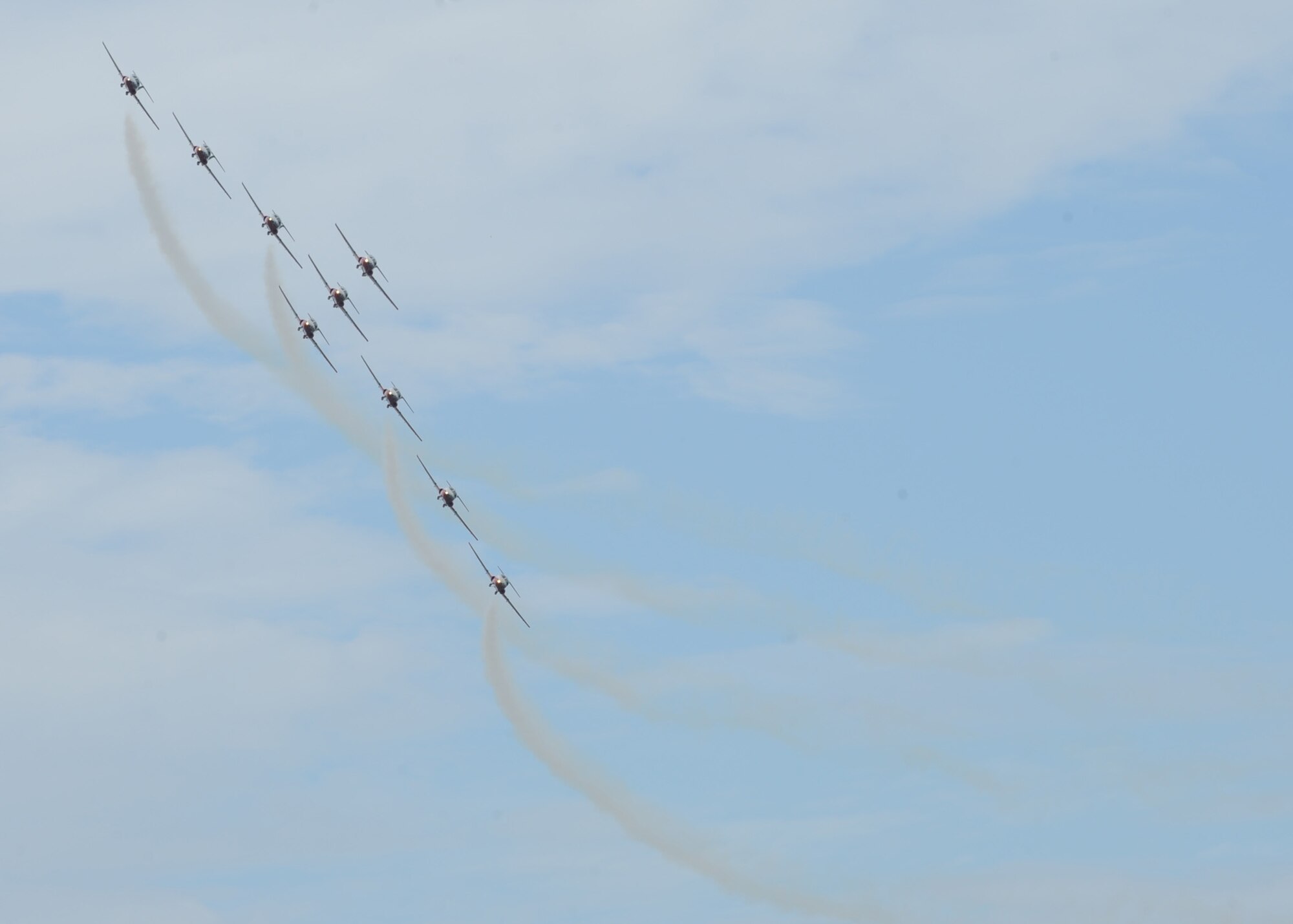 SCOTT AIR FORCE BASE, Ill. -- The Canadian Snowbirds perform one of many aerial stunts for crowds of 60,000 people at Scott, Saturday during the Air Power over the Midwest air show. The Snowbirds were the main attraction at the air show this year. (U.S. Air Force photo/Airman 1st Class Wesley P. Farnsworth)