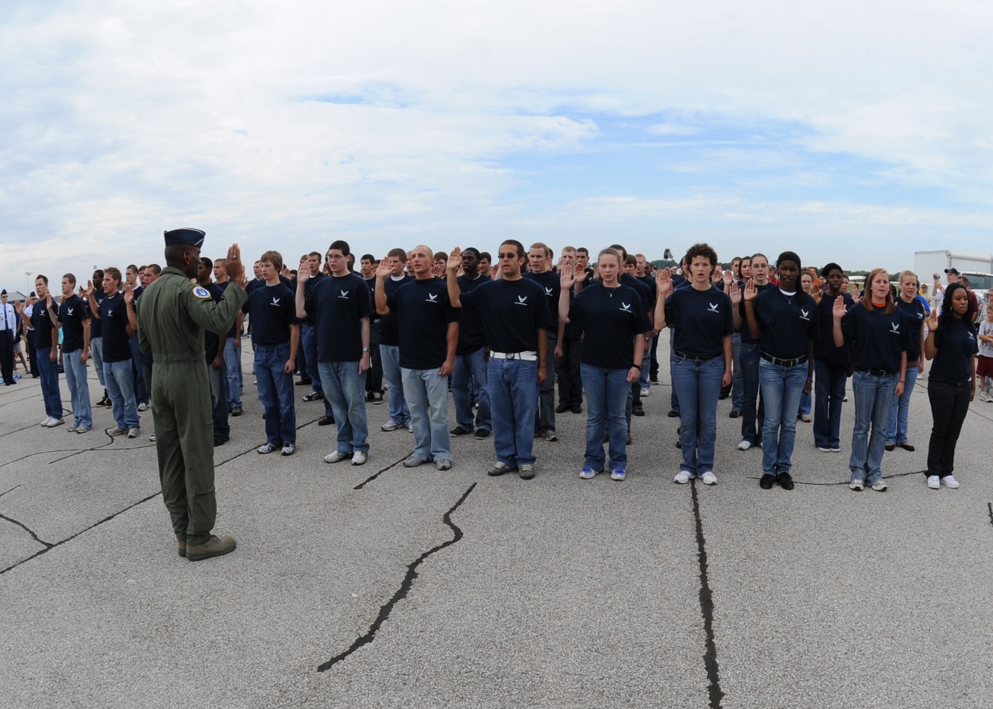 SCOTT AIR FORCE BASE, Ill. -- Brigadier Gen. A.J. Stewart, Air Force Recruiting Service commander, gives the oath of enlistment to 69 members of the delayed enlistment program at the Air Power over the Midwest air show on Scott. Saturday. (U.S. Air Force photo/Airman 1st Class Wesley P. Farnsworth)