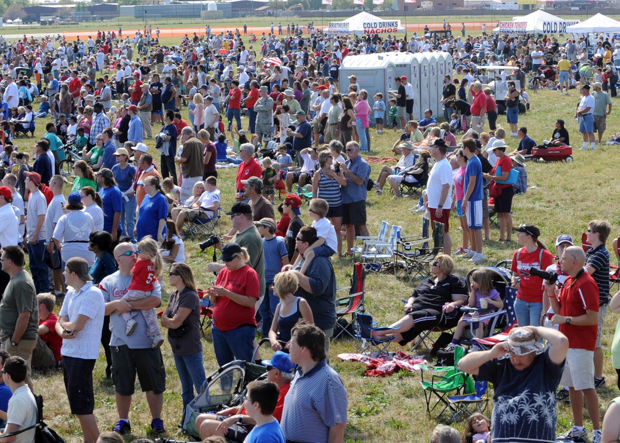 SCOTT AIR FORCE BASE, Ill. -- Crowds of 60,000 people gather to watch air demonstrations at the Air Power over the Midwest air show on Scott, Saturday. Air demonstrations included performances by the U.S. Army Golden Knights, and the Canadian Snowbirds. (U.S. Air Force photo/Airman 1st Class Wesley P. Farnsworth)