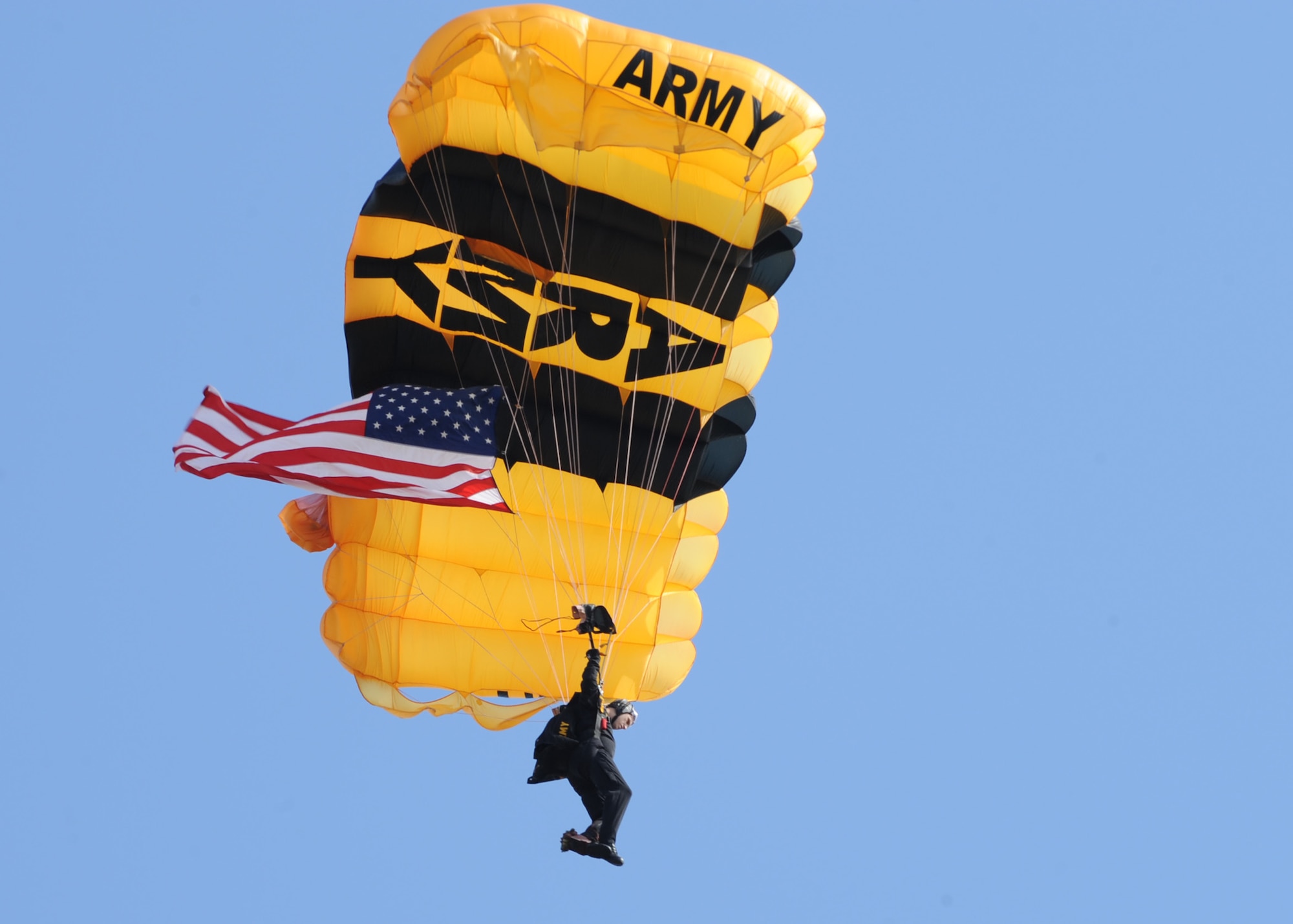 SCOTT AIR FORCE BASE, Ill. -- aA member of the U.S. Army Golden Knights drops in with the U.S. flag, during the opening ceremonies of Air Power over the Midwest air show on Scott. Saturday. The two day event showcases what the U.S. Air Forces does as well as gives attendees a chance to see part of Scott. (U.S. Air Force photo/Airman 1st Class Wesley P. Farnsworth)
