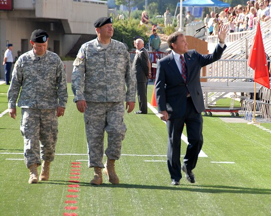 Utah Governor Gary R. Herbert waves to the crowd alongside Maj. Gen. BrianTarbet, the Adjutant General of Utah, and Brig. Gen. Michael Liechty, commander, Utah NG Land Component Command, at the Governor's Day celebration held on September 19 at the Rice Eccles Stadium. Approximately 5,300 Utah Air and Army Guardsmen participated in the event. U.S. Air Force photo by Staff Sgt. Emily Monson.
