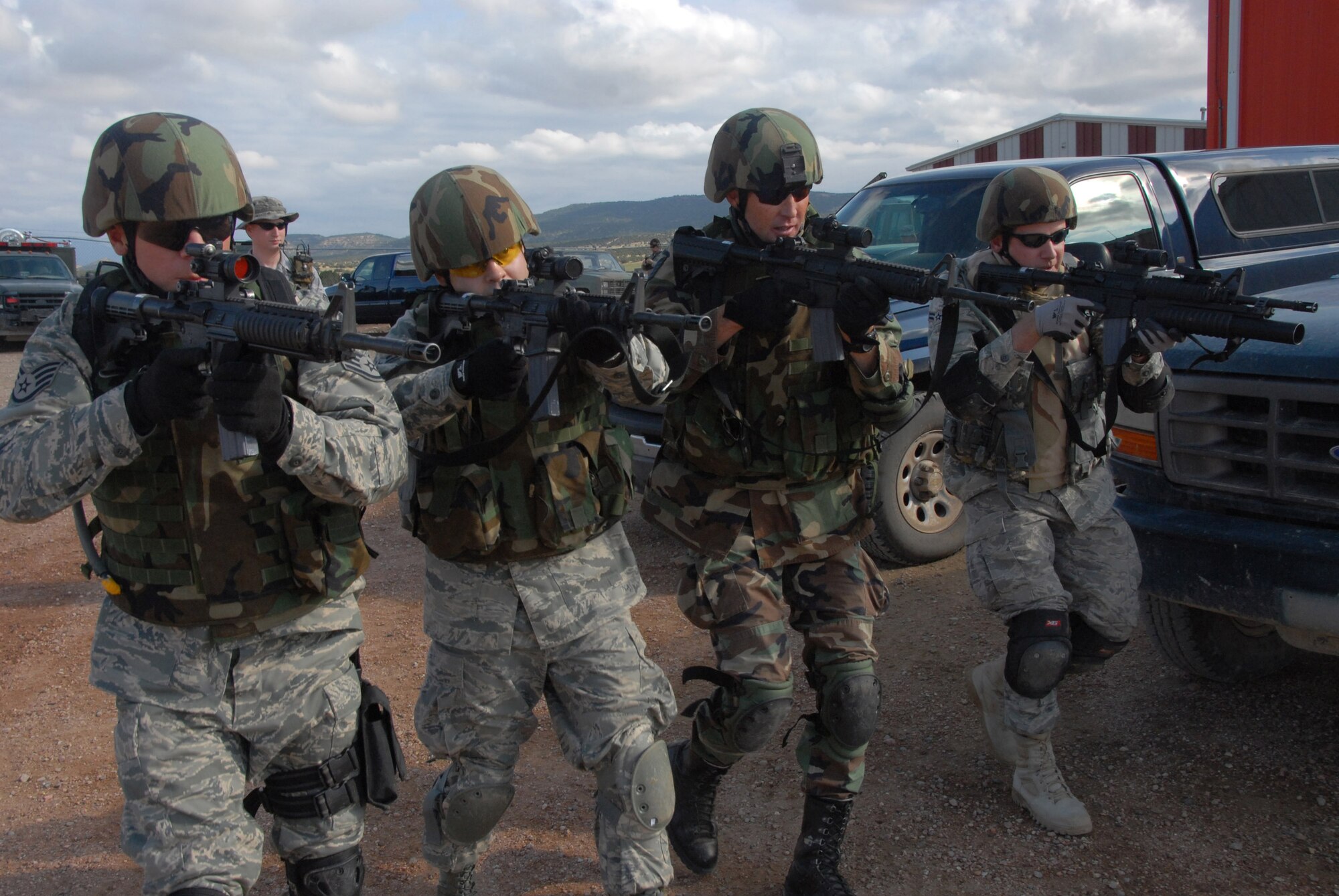 With weapons ready, Airmen of the 140th Security Forces Squadron practice combat formations prior Sept. 12, 2009 at the Airburst Range in Fort Carson, Colo. During this portion of the training exercise, Airmen are learning how to negotiate the unstable terrain, while moving together and staying in formation. (Official U.S. Air Force photo by Staff Sgt. Armando Argiz, Colorado Air National Guard/Released)