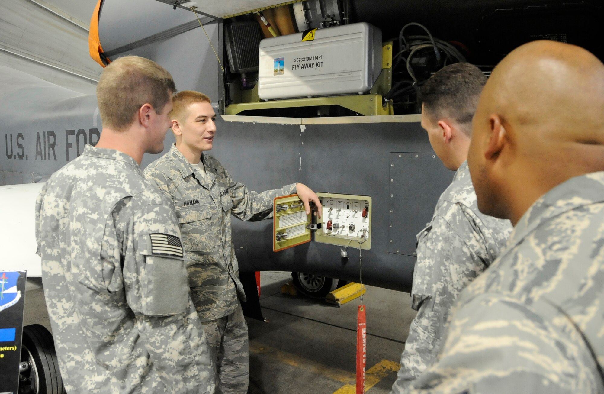 SOUTHWEST ASIA - Staff Sgt. Drew Hamann, 380th Expeditionary Aircraft Maintenance Squadron, briefs Explosive Ordnance Disposal Soldiers en route to Afghanistan and 380th Expeditionary Wing Airmen about the Global Hawks capabilities Sept. 19, 2009. Sergeant Hamann is deployed from Beale Air Force Base, Calif., and hails from Truckee, Calif. (U.S. Air Force photo/Senior Airman Stephen Linch) 
