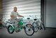 Master Sgt. Darrell Miller, an F-16 crew chief with the 115th Fighter Wing, shows off one of the custom bikes available for use.