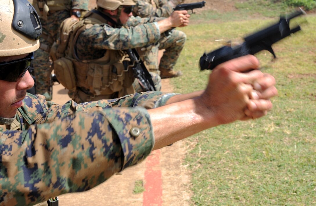 Cpl. Michael Vanwinkle fires his M9 pistol at targets during a live-fire exercise here, Sept. 20. Vanwinkle and the rest of Reconnaissance Platoon, Battalion Landing Team 2/4, 11th Marine Expeditionary Unit, were in Hawaii Sept. 17-22 for final training before deploying with the 11th Marine Expeditionary Unit Sept. 24.