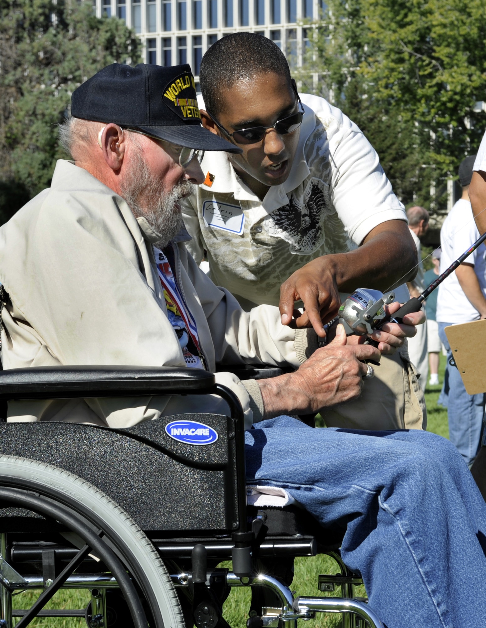 BOISE, Idaho -- Staff Sgt. Calvin Holtmeyer, 366th Logistics Readiness Squadron, assists veteran George Anderson during the 22nd Annual Veterans Olympics Sept. 19 at the Veterans Home in Boise, Idaho. Hosted by the Idaho State Veterans Home and the Veterans Administration Medical Center, the games were created to allow veterans of varying ages and physical abilities to compete in modified sporting events similar to those featured in the Olympic Games. The base has provided hundreds of volunteers for more than 20 years to run the events and acts as escorts. (U.S. Air Force photo by Senior Airman Samantha S. Crane)
