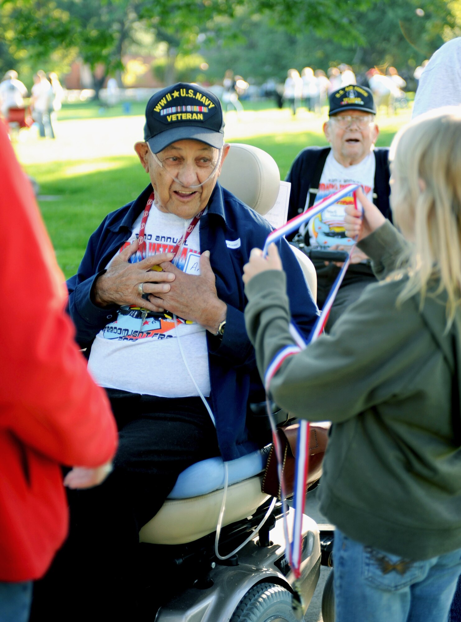 BOISE, Idaho -- Arthur Leded, a Navy veteran from World War II, receives his participation medal during the 22nd Annual Veterans Olympics Sept. 19 at the Veterans Home in Boise, Idaho. Hosted by the Idaho State Veterans Home and the Veterans Administration Medical Center, the games were created to allow veterans of varying ages and physical abilities to compete in modified sporting events similar to those featured in the Olympic Games. The base has provided hundreds of volunteers for more than 20 years to run the events and acts as escorts. (U.S. Air Force photo by Senior Airman Samantha S. Crane)