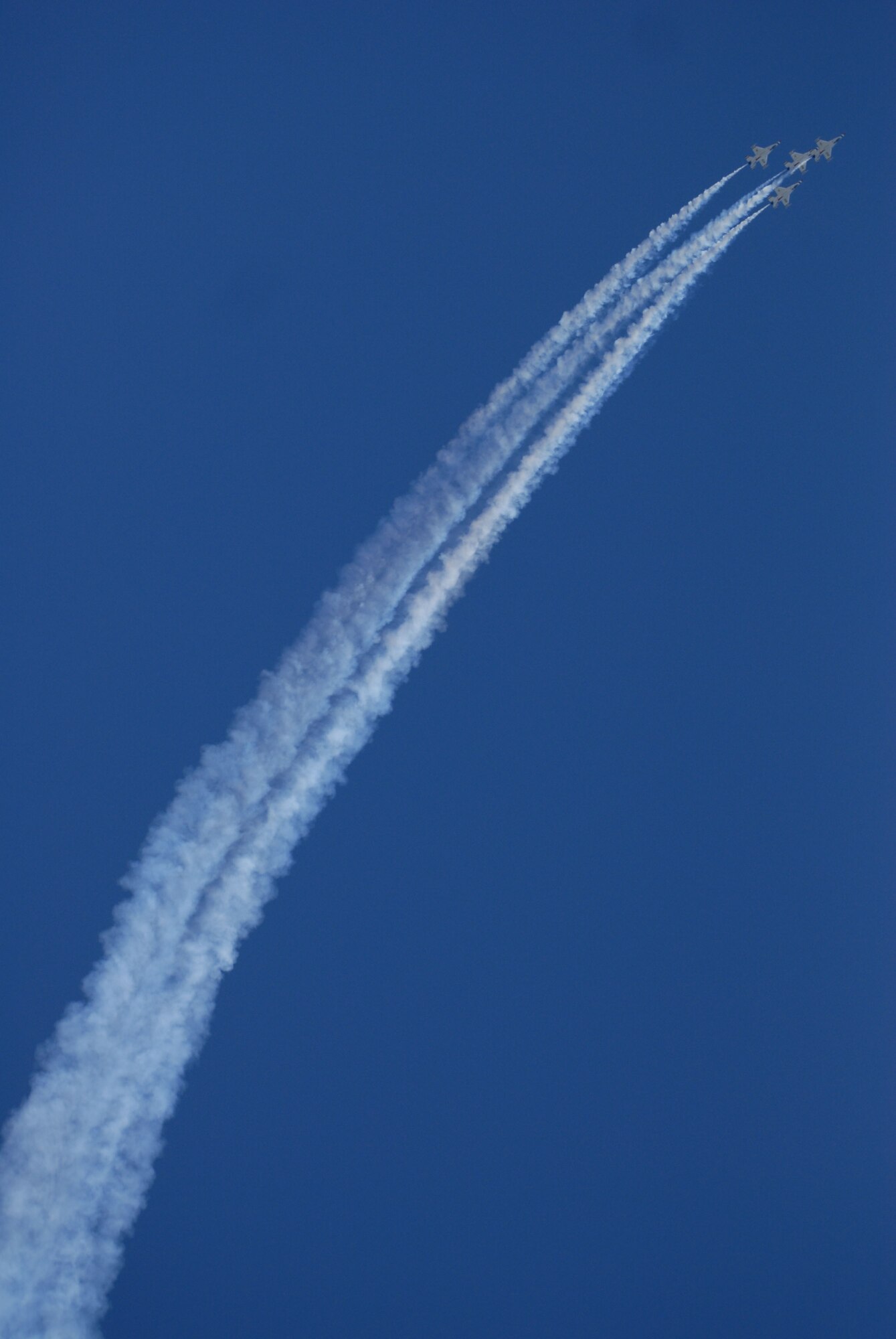 HICKAM AIR FORCE BASE, Hawaii -- Four Thunderbirds, U.S. Air Force Air Demonstration Squadron, perform combat maneuvers during the Open House, "Wings over the Pacific," here, Sep. 20. The Open House featured live band performances, static displays and The Thunderbirds demonstrated the capabilities of the F-16 Fighting Falcon. Over 99,000 people attended the two day event. (U.S. Air Force photo/Senior Airman Gustavo Gonzalez)
