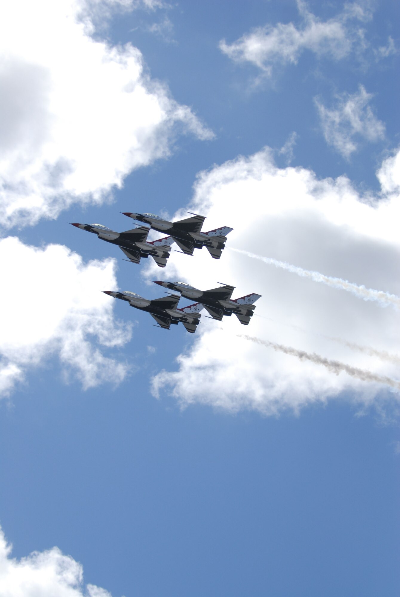 HICKAM AIR FORCE BASE, Hawaii -- Four Thunderbirds, U.S. Air Force Air Demonstration Squadron, perform combat maneuvers during the Open House, "Wings over the Pacific," here, Sep. 20. The Open House featured live band performances, static displays and The Thunderbirds demonstrated the capabilities of the F-16 Fighting Falcon. Over 99,000 people attended the two day event. (U.S. Air Force photo/Senior Airman Gustavo Gonzalez)