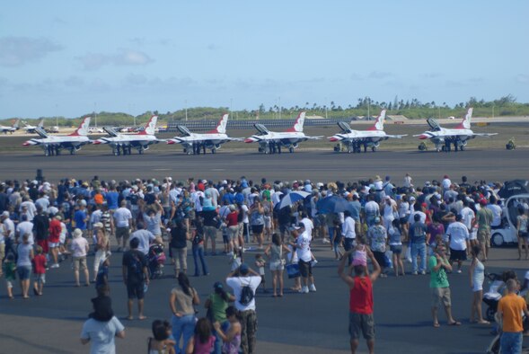 HICKAM AIR FORCE BASE, Hawaii -- Audience members watch the Thunderbirds, U.S. Air Force Air Demonstration Squadron, prepare their F-16's for take off during the Open House, "Wings over the Pacific," here, Sep. 19. The Open House featured live band performances, static displays and The Thunderbirds demonstrated the capabilities of the F-16 Fighting Falcon when they performed combat maneuvers. Over 99,000 people attended the two day event. (U.S. Air Force photo/Senior Airman Gustavo Gonzalez)