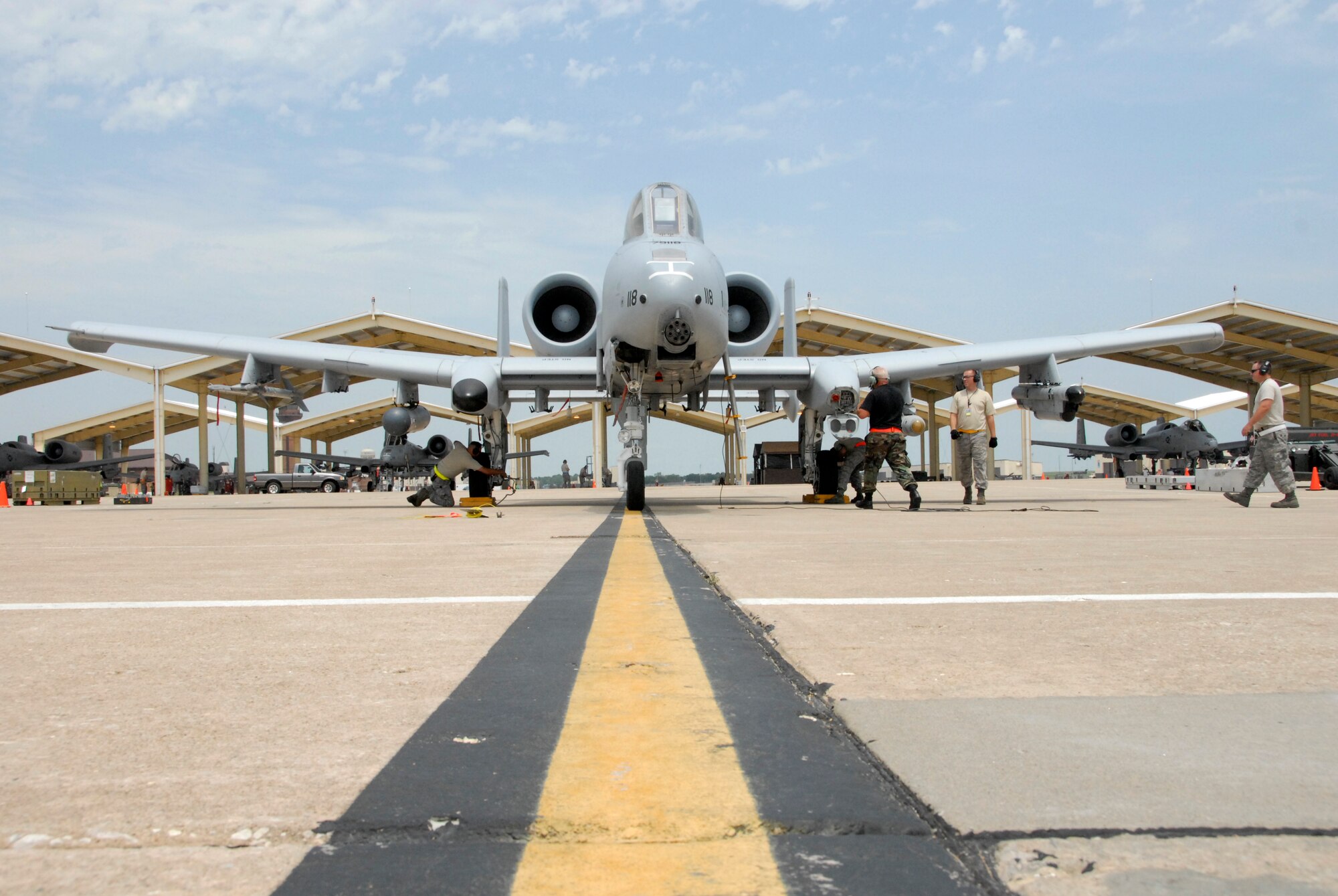 Maintenance crews from the 442nd Fighter Wing's 442nd Maintenance Group prepare an A-10 for flight July 12, 2009, during an exercise to practice for the wing's upcoming operational readiness inspection in October.  In a program initiated by the 442nd Chaplain's office, wing members will be able to offer up prayers for A-10 pilots and ground crews to help fly the required number of sorties during the inspection.  (U.S. Air Force photo/Staff Sgt. Kent Kagarise)