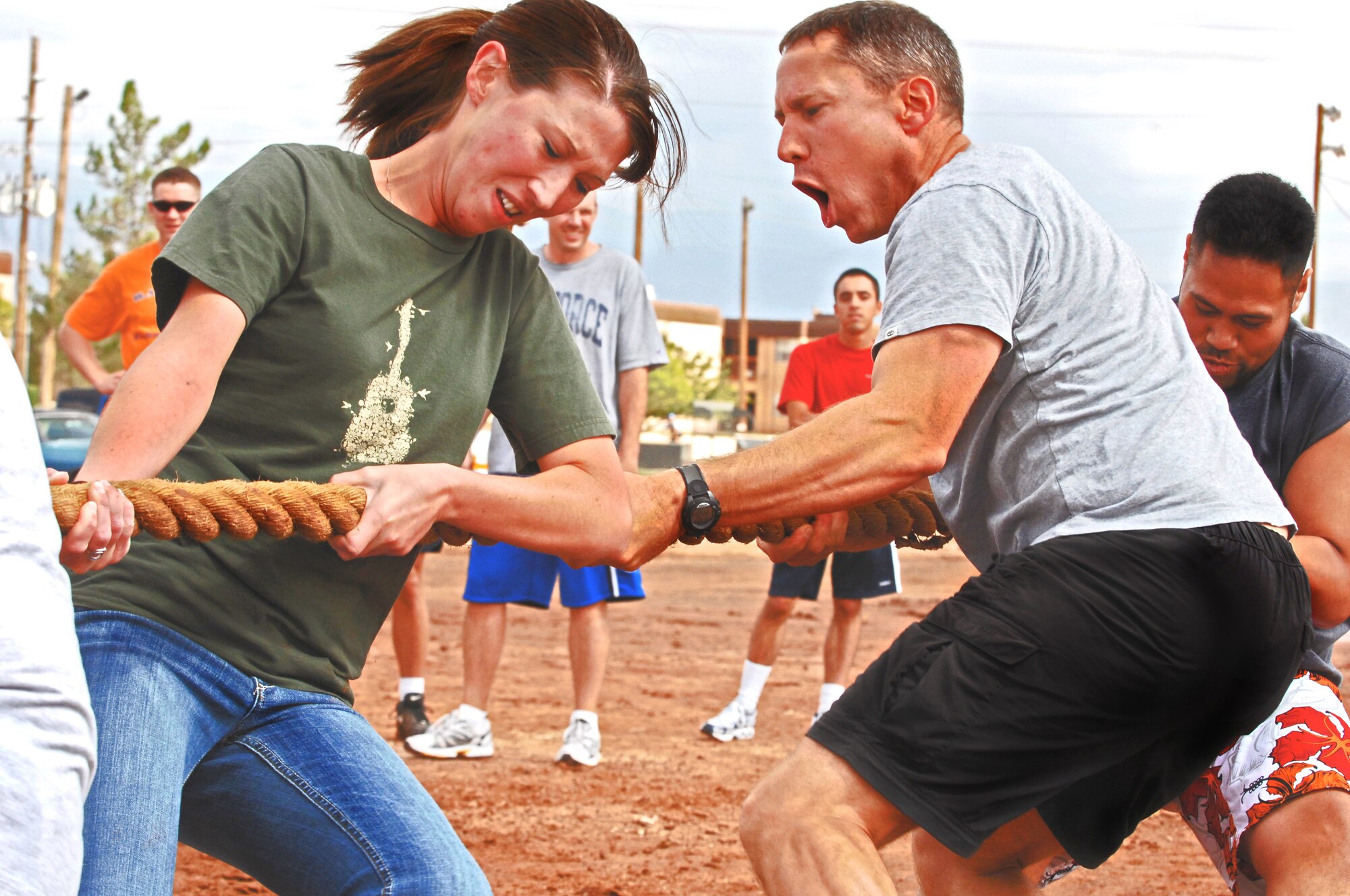 HOLLOMAN AIR FORCE BASE, N.M. -- Airman 1st Class Kristina Flanigan and Senior Master Sgt. Brent Bland, 49th Force Support Squadron, strain to pull the rope during the tug of war event on Sports Day at the Domenici Fitness and Sports Center on Holloman Air Force Base, N.M., Sept. 18. The 49th Security Forces Squadron was the large unit winner of the tug of war event. Members from 16 squadrons competed in a variety of sports while spectators observed and rooted for their colleagues during the morale-boosting event.(U.S. Air Force photo by Staff Sgt. Anthony Nelson Jr.)