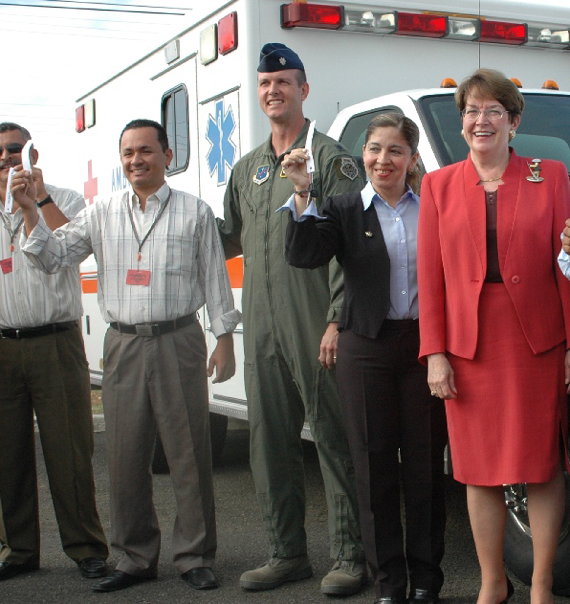 FORWARD OPERATING LOCATION MANTA, Ecuador -- Lt. Col. Jared Curtis, 478th Expeditionary Operations Squadron commander, stands with local citizens in front of an ambulance donated to an organization near FOL Manta Sept. 16. To mark the end of 10 years of community relations activities, officials donated almost $1 million worth of equipment, food and supplies to local establishments. FOL Manta was deactivated Sept. 18 after a lease between the United States and Ecuador expired. (Courtesy Photo)