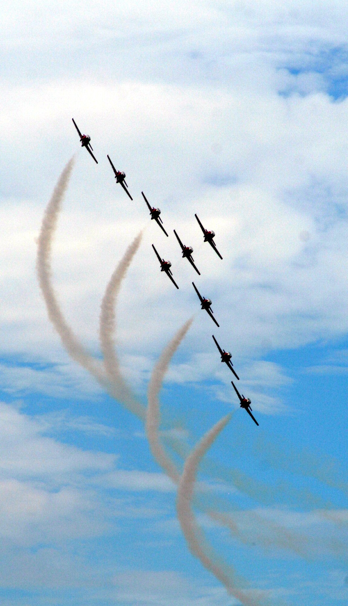CT-114 Tutor planes from the Canadian Forces Snowbirds aerial demonstration hold a demonstration event during the 2009 Scott Air Force Base Airshow on Sept. 19, 2009, at Scott AFB, Ill.  The airshow drew tens of thousands of people and featured a wide variety of aircraft on static display and in aerial performances.  (U.S. Air Force Photo/Tech. Sgt. Scott T. Sturkol)