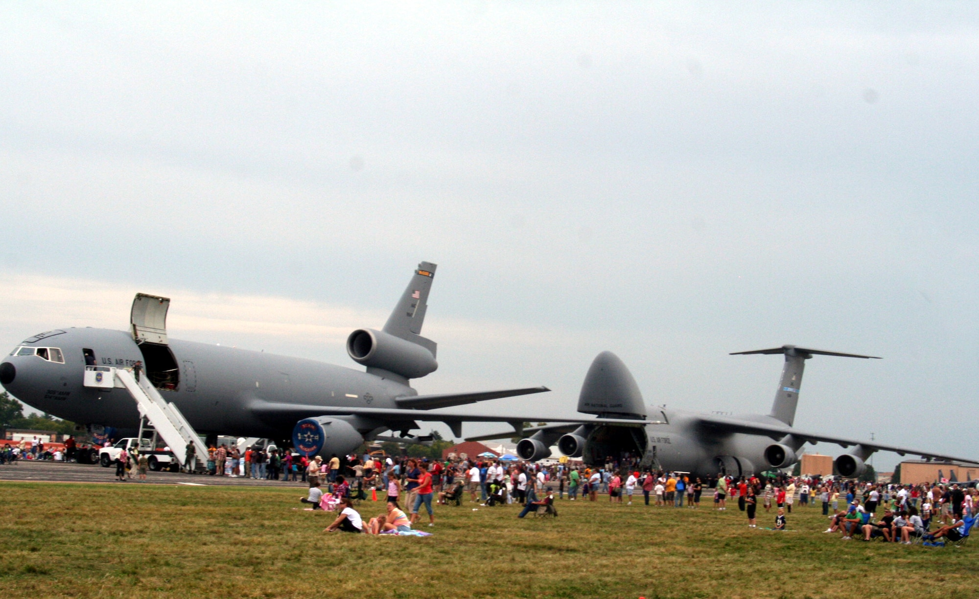 Attendees to the 2009 Scott Air Force Base Airshow look at static display aircraft on Sept. 19, 2009, at Scott AFB, Ill.  The airshow drew tens of thousands of people and featured a wide variety of aircraft on static display and in aerial performances.  (U.S. Air Force Photo/Tech. Sgt. Scott T. Sturkol)