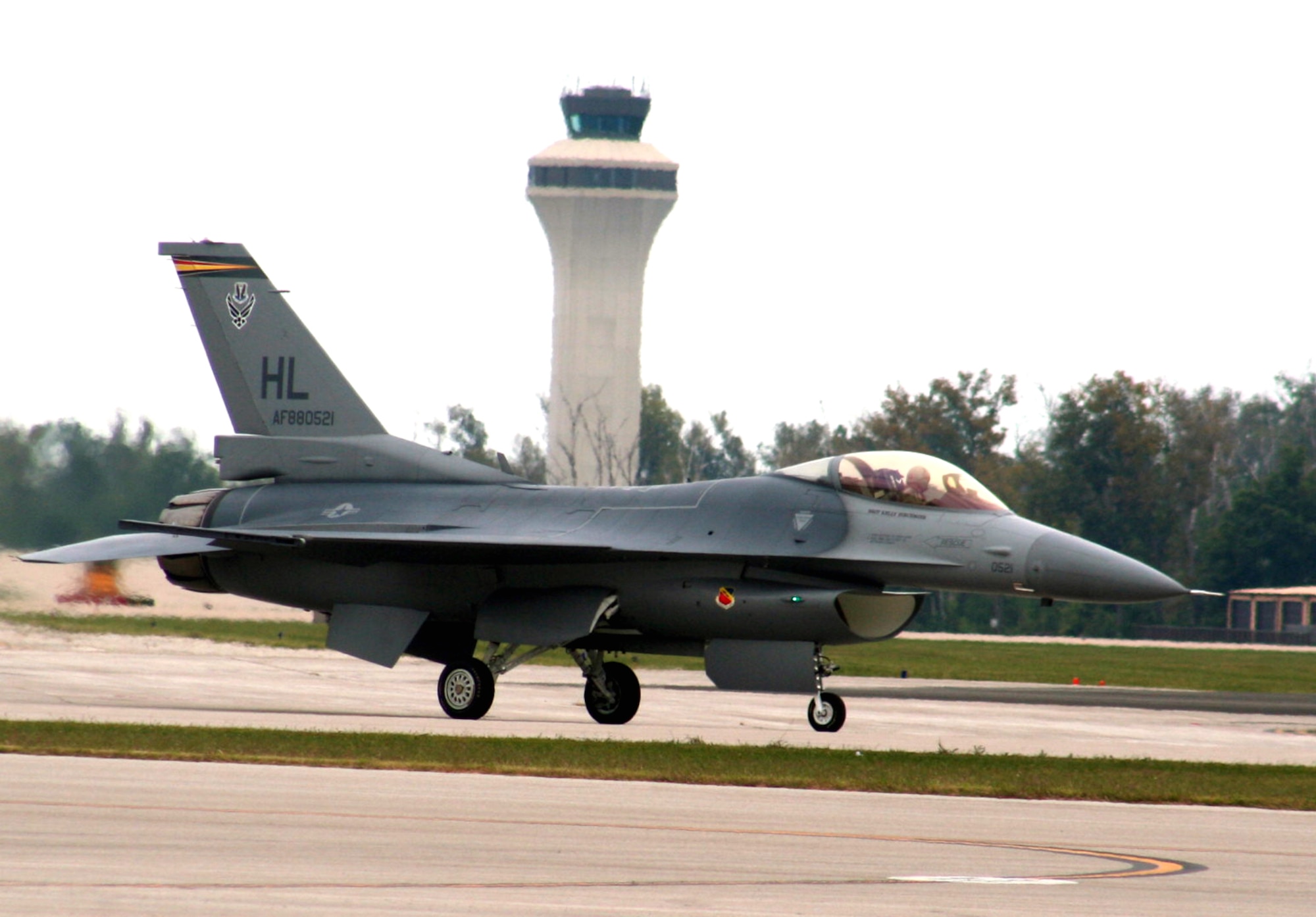An F-16 Fighting Falcon taxi to a parking areas after completing an aerial demonstration during the 2009 Scott Air Force Base Airshow on Sept. 19, 2009, at Scott AFB, Ill.  The airshow drew tens of thousands of people and featured a wide variety of aircraft on static display and in aerial performances.  (U.S. Air Force Photo/Tech. Sgt. Scott T. Sturkol)