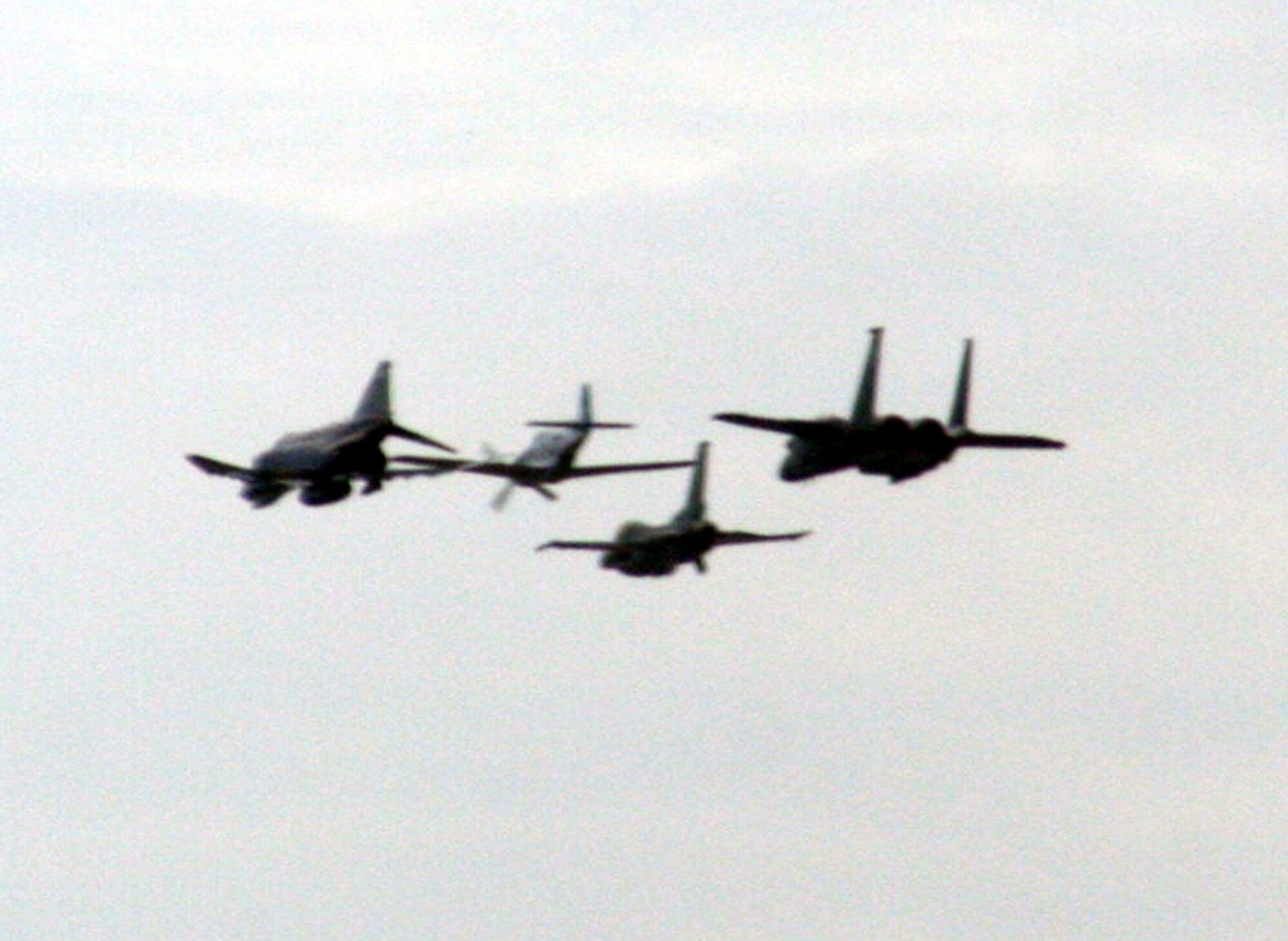A formation of vintage and current Air Force planes fly in formation during the 2009 Scott Air Force Base Airshow on Sept. 19, 2009, at Scott AFB, Ill.  The airshow drew tens of thousands of people and featured a wide variety of aircraft on static display and in aerial performances.  (U.S. Air Force Photo/Tech. Sgt. Scott T. Sturkol)