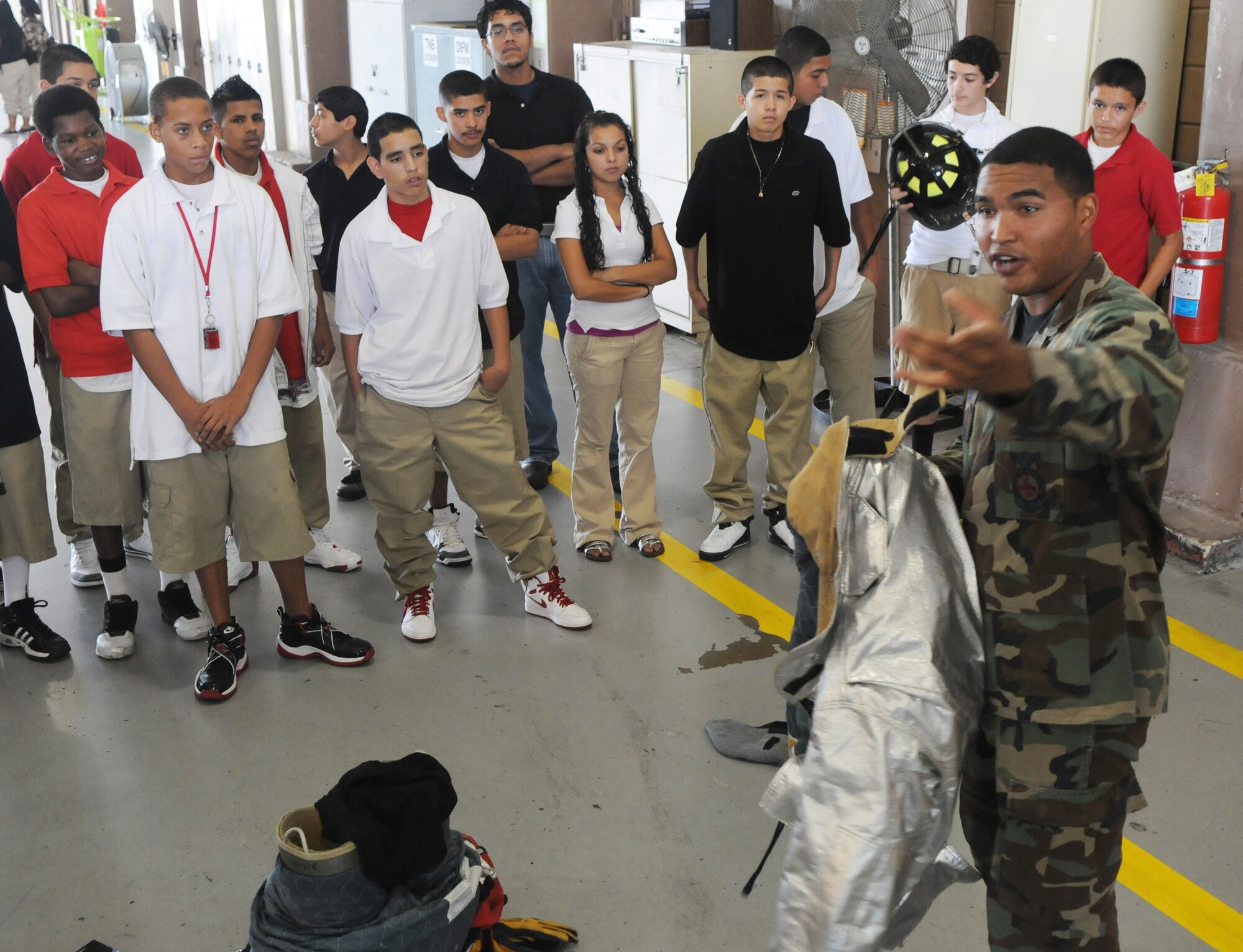 Senior Airman Trevor Alexis briefs members of Giving Americans Motivational Education for the Real World program from Fox Technical High School Sept. 11, 2009, to Randolph Air Force Base, Texas. The briefing was part of a tour of Randolph AFB, highlighting what an Air Force career may hold for the students. Airman Alexis is assigned to the 12th Civil Engineer Squadron fire department. (U.S. Air Force photo/Rich McFadden) 