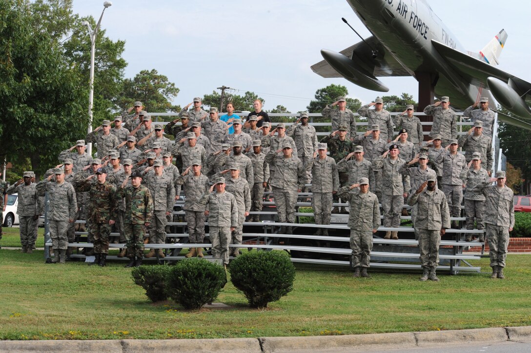 4th Fighter Wing Airmen salute during the singing of the Star Spangled Banner during the Prisoners of War – Missing in Action remembrance ceremony at Seymour Johnson Air Force Base, N.C., Sept. 18, 2009. The song, a poem written by Frances Scott Key, became America’s National Anthem in 1931. (U.S. Air Force photo by Airman 1st Class Whitney Lambert)