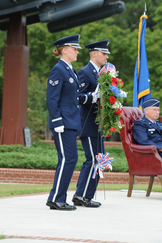 Senior Airmen Makenzie Lang and Stephen Bigler, 4th Fighter Wing base honor guard members, escort the Prisoners of War – Missing in Action wreath to the stage during the POW/MIA remembrance ceremony at Seymour Johnson Air Force Base, N.C., Sept. 18, 2009. The first day honoring POW/MIAs was July 18, 1979, with a flyover performed by the 1st Tactical Squadron from Langley AFB, Va. (U.S. Air Force photo by Airman 1st Class Whitney Lambert)