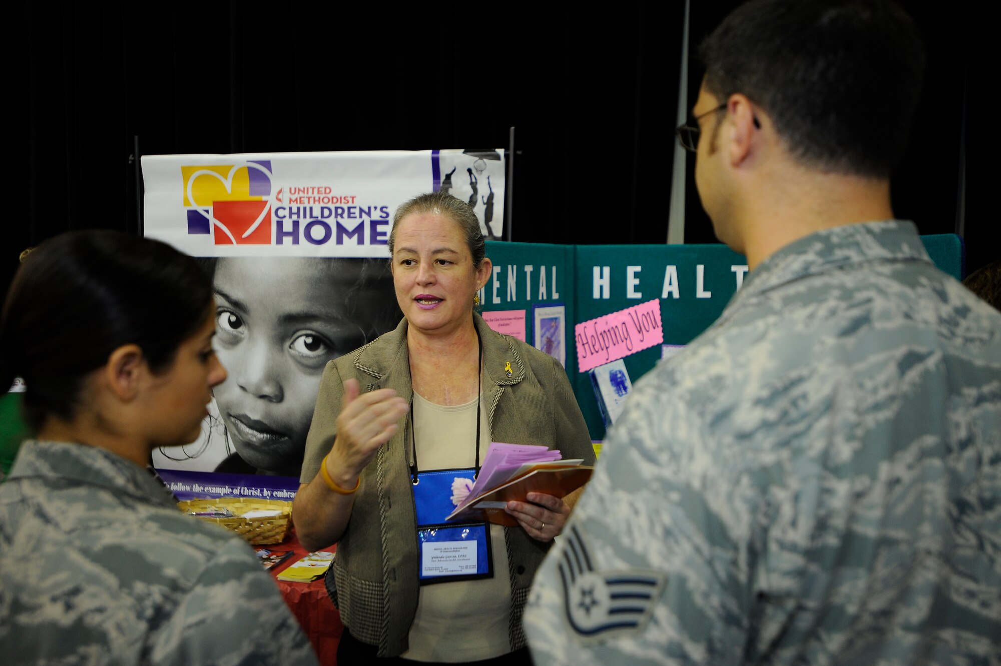 HURLBURT FIELD, Fla. ? Airmen listen to a presentation by one of the more than 40 charities set up during the Combined Federal Campaign kickoff at the Emerald Coast Conference Center Sept. 17. The CFC is the world's largest annual workplace charity campaign used to collect donations to support non-profit organizations that provide health and human service benefits throughout the world. (U.S. Air Force photo/Senior Airman Jason Epley)