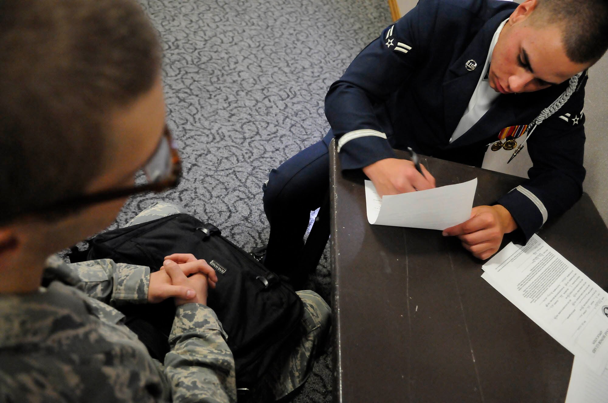 Senior Airman Jezel Reyes-Torres, United States Honor Guard Drill Team four-man trainer, interviews a basic trainee as part of the recruiting process into the Air Force Honor Guard Sept. 19 at Lackland Air Force Base, Texas. Basic trainees were treated to a performance by the Honor Guard Drill Team before being given the opportunity to join the Air Force Honor Guard. Members of the Honor Guard’s Drill Team and recruiting section were at basic training to perform for trainees as well as recruit new Honor Guard members. (U.S. Air Force photo by Staff Sgt. Dan DeCook)
