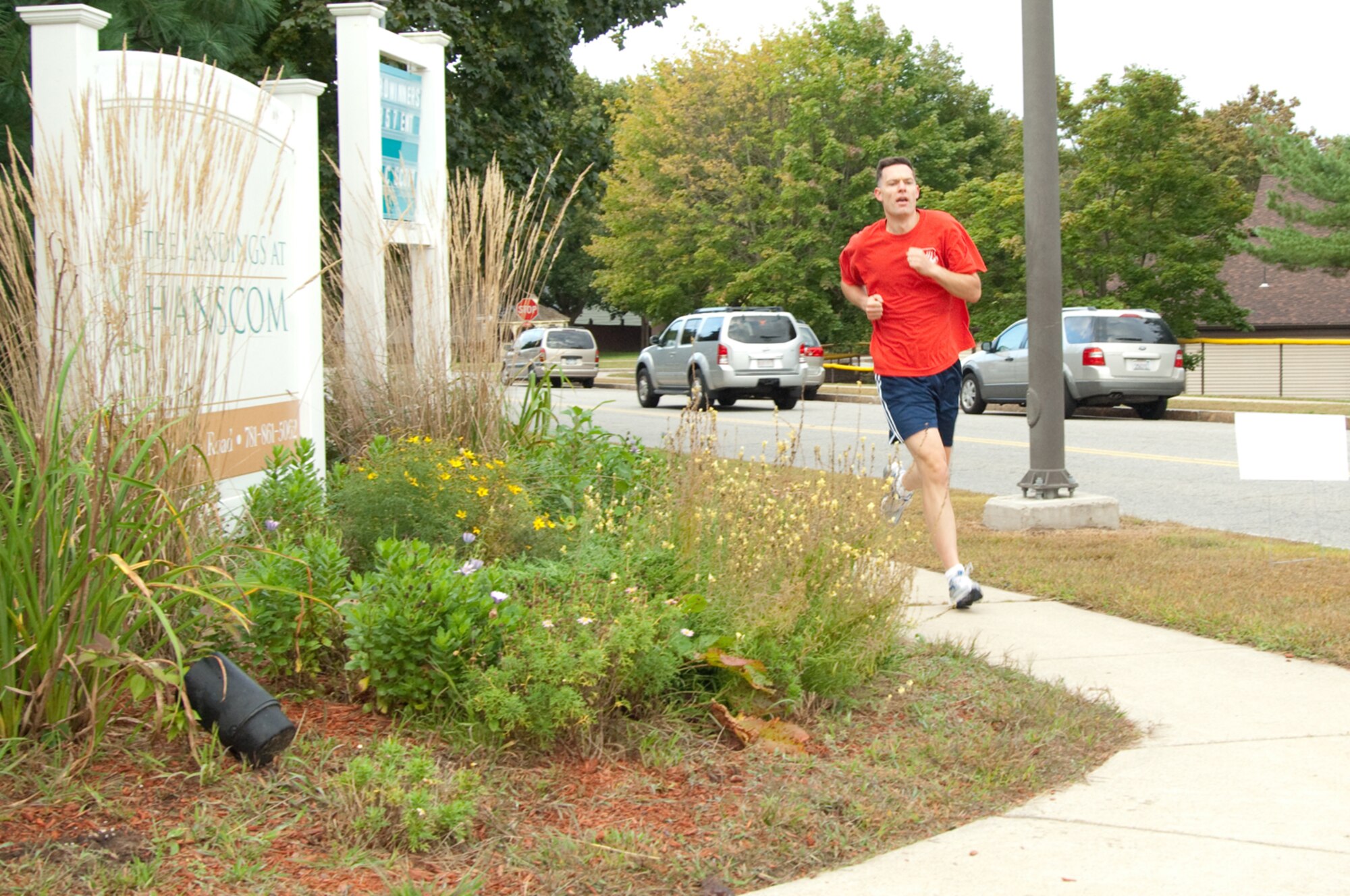 HANSCOM AIR FORCE BASE, Mass. – Lieutenant Colonel Andrew Nicklas, 642nd Electronic Systems Squadron, rounds a corner in Hanscom’s housing area during the 5K Back to School fitness run on Sept. 16. Forty eight participants competed in the race. The top male runner was Major Grady Tibboel, 753rd Electronic Systems Group with a time of 20:37; the top female runner was Major Kristin Petersen, Electronic Systems Center Legal Office with a time of 23:11. (U.S. Air Force photo by Rick Berry)