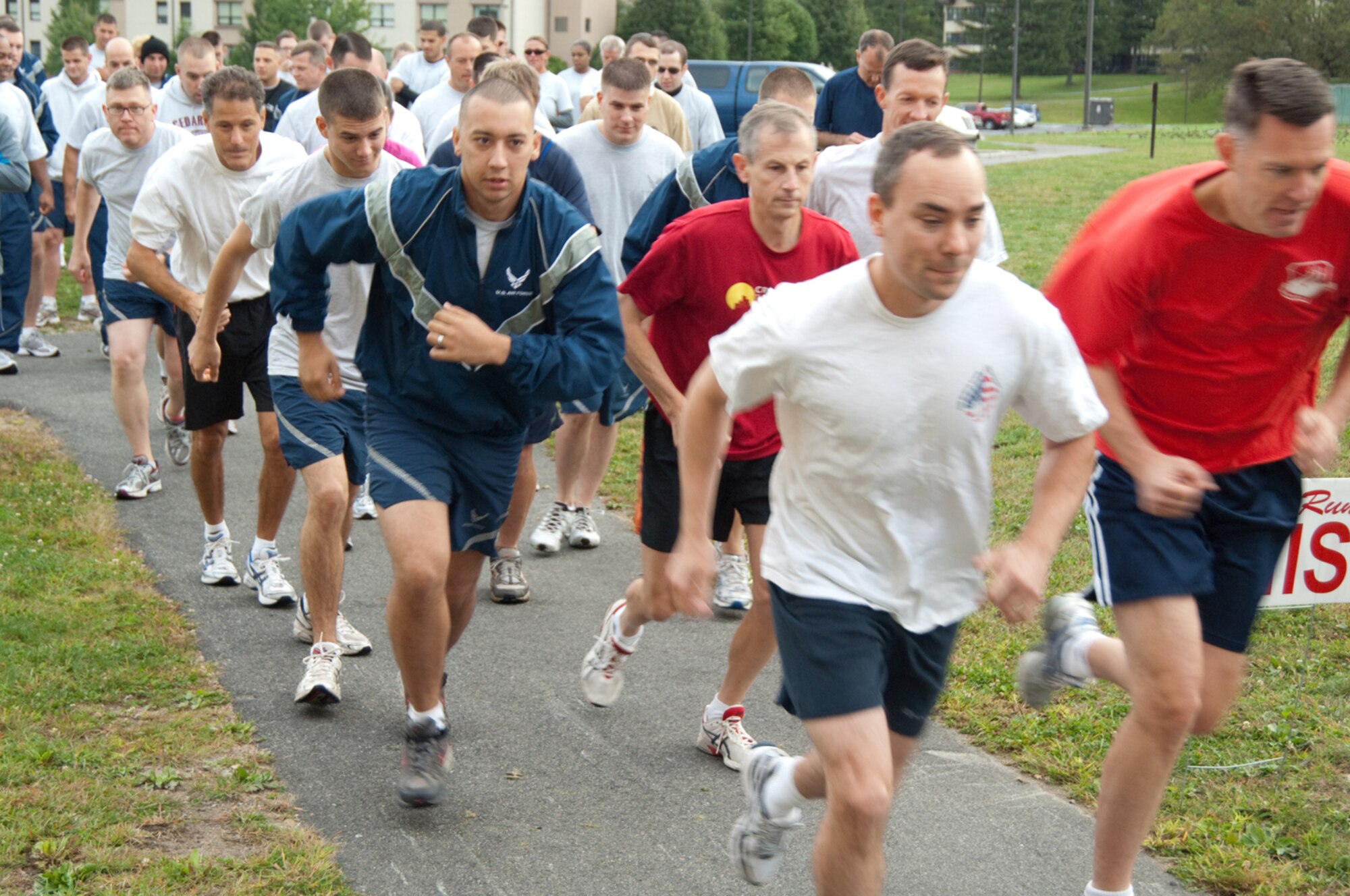HANSCOM AIR FORCE BASE, Mass. – Runners take off from the start of the Fitness Center’s Back to School 5K fitness run on Sept. 16. Forty eight participants competed in the race. The top male runner was Major Grady Tibboel, 753rd Electronic Systems Group with a time of 20:37; the top female runner was Major Kristin Petersen, Electronic Systems Center Legal Office with a time of 23:11. (U.S. Air Force photo by Rick Berry)