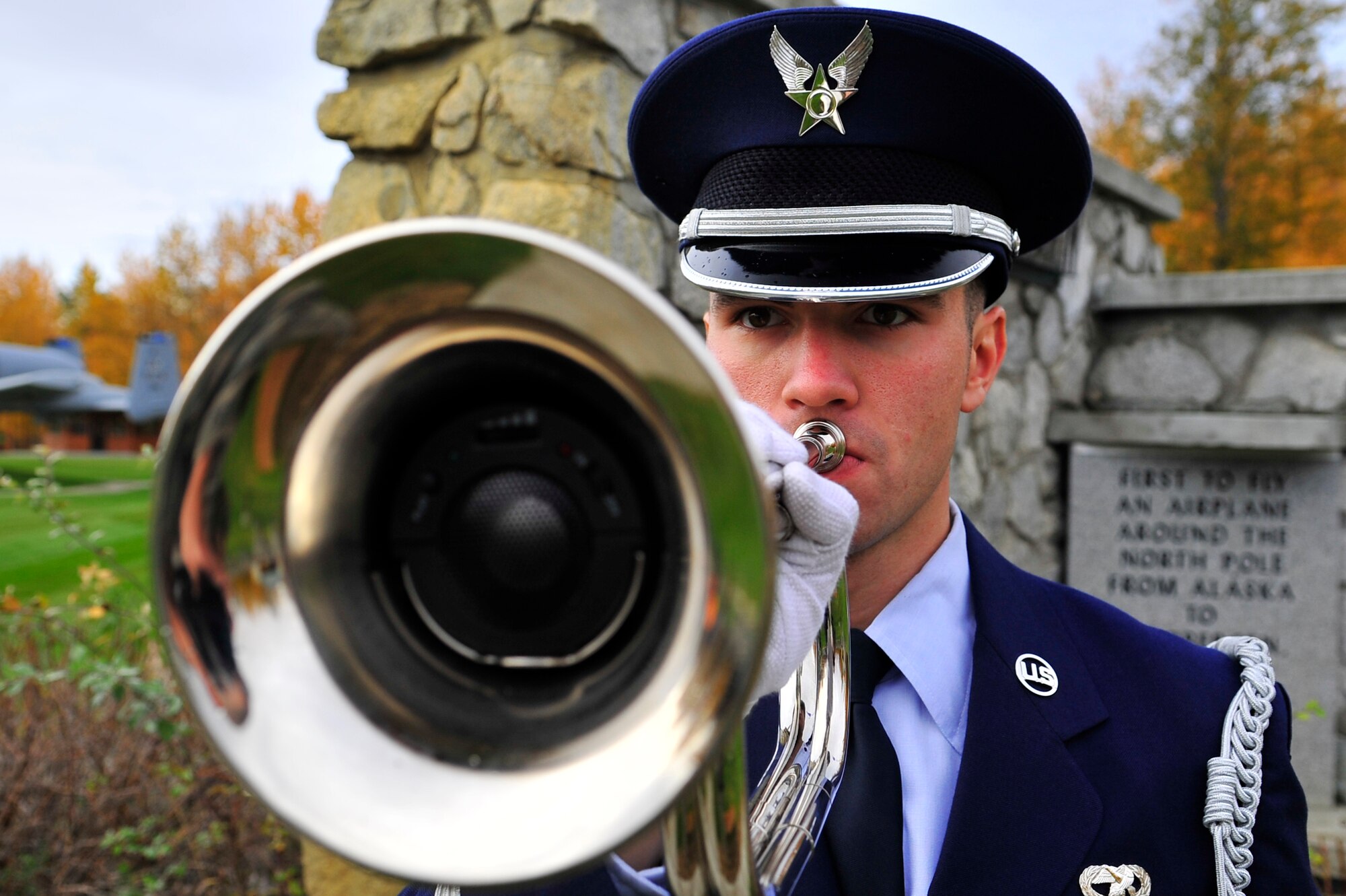 An Airman from the honor guard plays taps during the Prisoners of War/Missing in Action ceremony Sept. 18, 2009, Eielson Air Force Base, Alaska. The POW/MIA ceremony pays tribute to those who were captured or have gone missing during war. Since World War I, over 296,800 Americans have been classified as POW/MIA. (U.S. Air Force photo/Staff Sgt. Christopher Boitz)