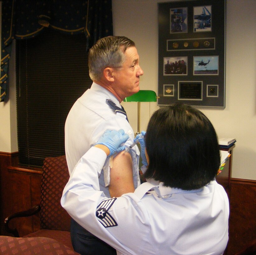 Brig. Gen. O.G. Mannon, 82nd Training Wing commander, receives his seasonal flu vaccination Sept. 21 from Staff Sgt. Christina Parker, 82nd Medical Operations Squadron allergy and immunizations technician. All active-duty members will be able to receive their seasonal flu shot at the base theater Sept. 30 from 11 a.m. to 5 p.m. and Oct. 2 from 7 a.m. to 1 p.m. (Photo courtesy U.S. Air Force)