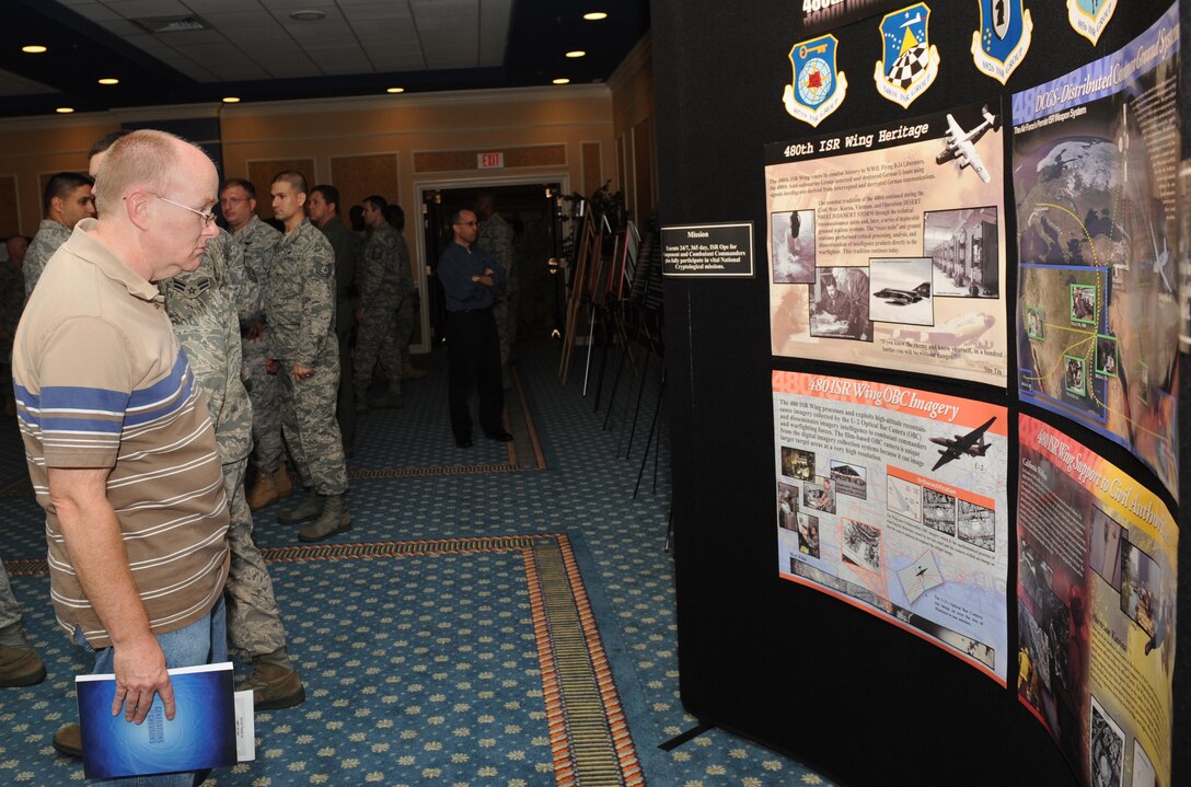 LANGLEY AIR FORCE BASE, Va. – Richard Puhlman, 1st Communications Squadron security accountant, views fact sheets on the 480th Intelligence, Surveillance and Reconnaissance Wing on display during Langley’s celebration of the Air Force’s birthday here Sept. 18.  The Bayside Enlisted Club held a celebration with music and food for the 62nd birthday.  (U.S. Air Force photo/Airman 1st Class Gul Crockett)