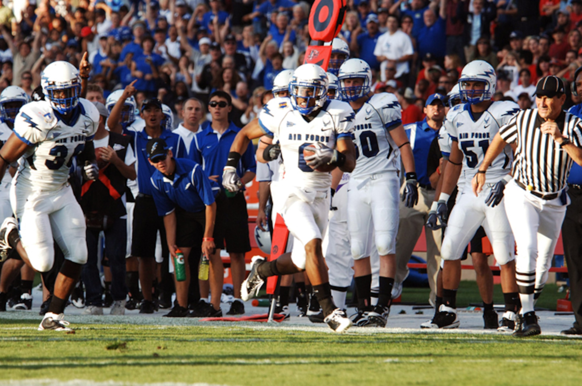 U.S. Air Force Academy defensive back Jon Davis races down the sidelines on his way to a 38-yard score on an interception return during football action Sept. 19, 2009, at Albuquerque, N.M. (U.S. Air Force photo/John Van Winkle) 