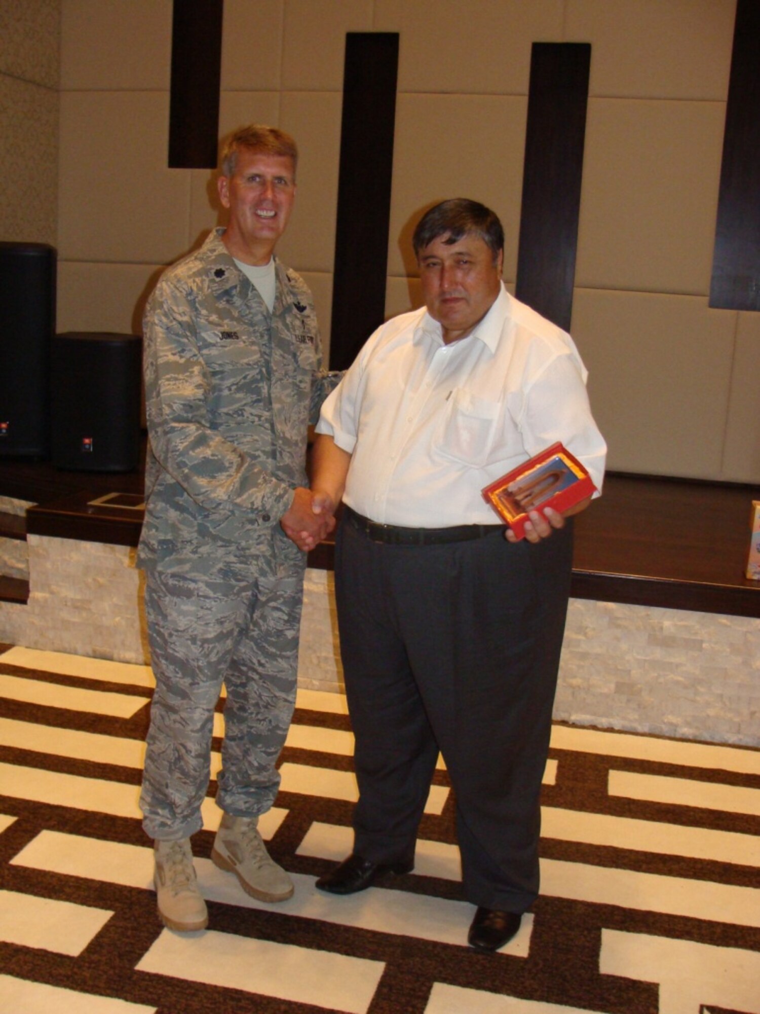 Lt. Colonel W. Tracy Jones (left) is shown with Tajikistan Minister of Health Nusratullo Salimov following a regional trauma and disaster response training event held in Tajikistan for 26 senior-level physicians representing Kyrgyzstan, Kazakhstan, and Tajikistan. (Air Force photo)
