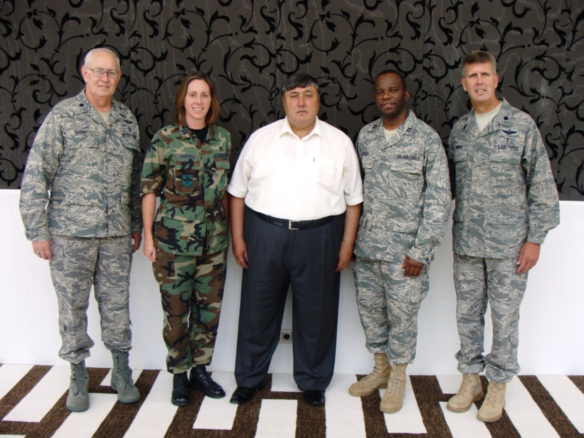 Defense Institute for Medical Operations members who participated in a training mission for physicians in the Central Asian country of Tajikistan included (from left): Lt. Col. Barry Thomas, Captain Heather Hancock, Mr. Nusratullo Salimov, Tajikistan Minister of Health; Captain Francis Obuseh, and Lt. Col. W. Tracey Jones. (Air Force photo)
